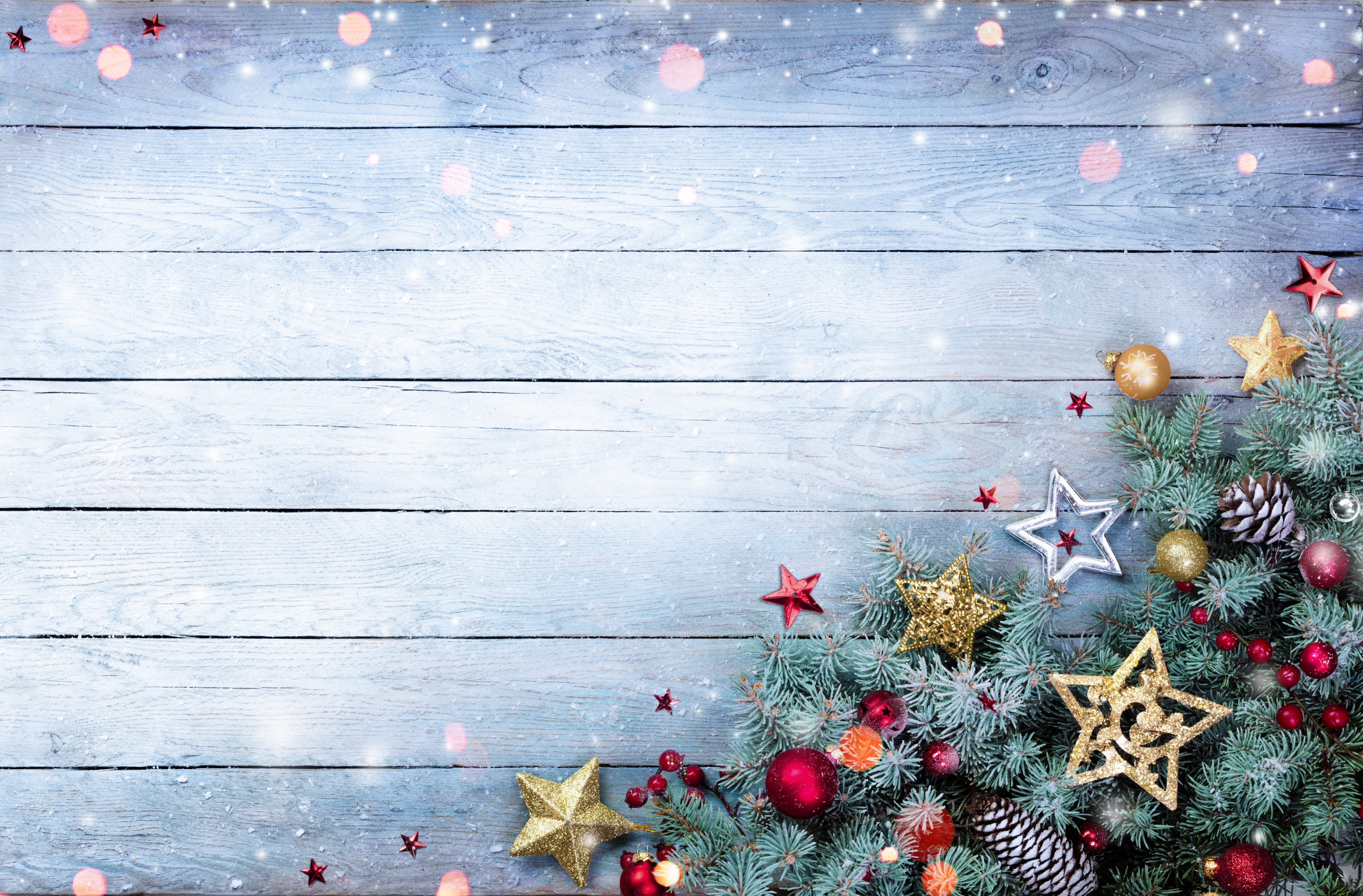 Christmas tree branches with ornaments on wood planks HD Wallpaper