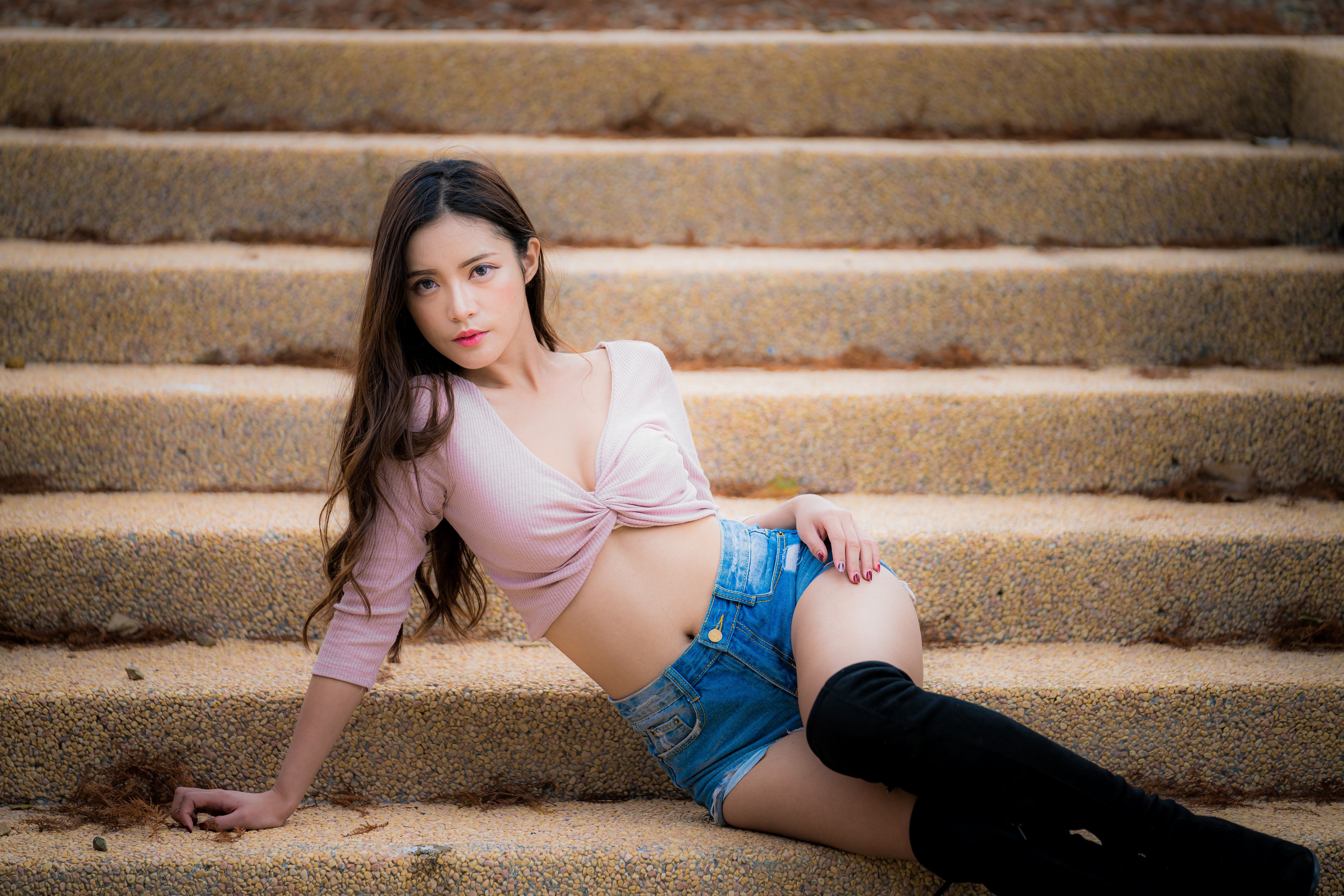 4K Asian Woman Sitting on Stairs in Boots HD Wallpaper
