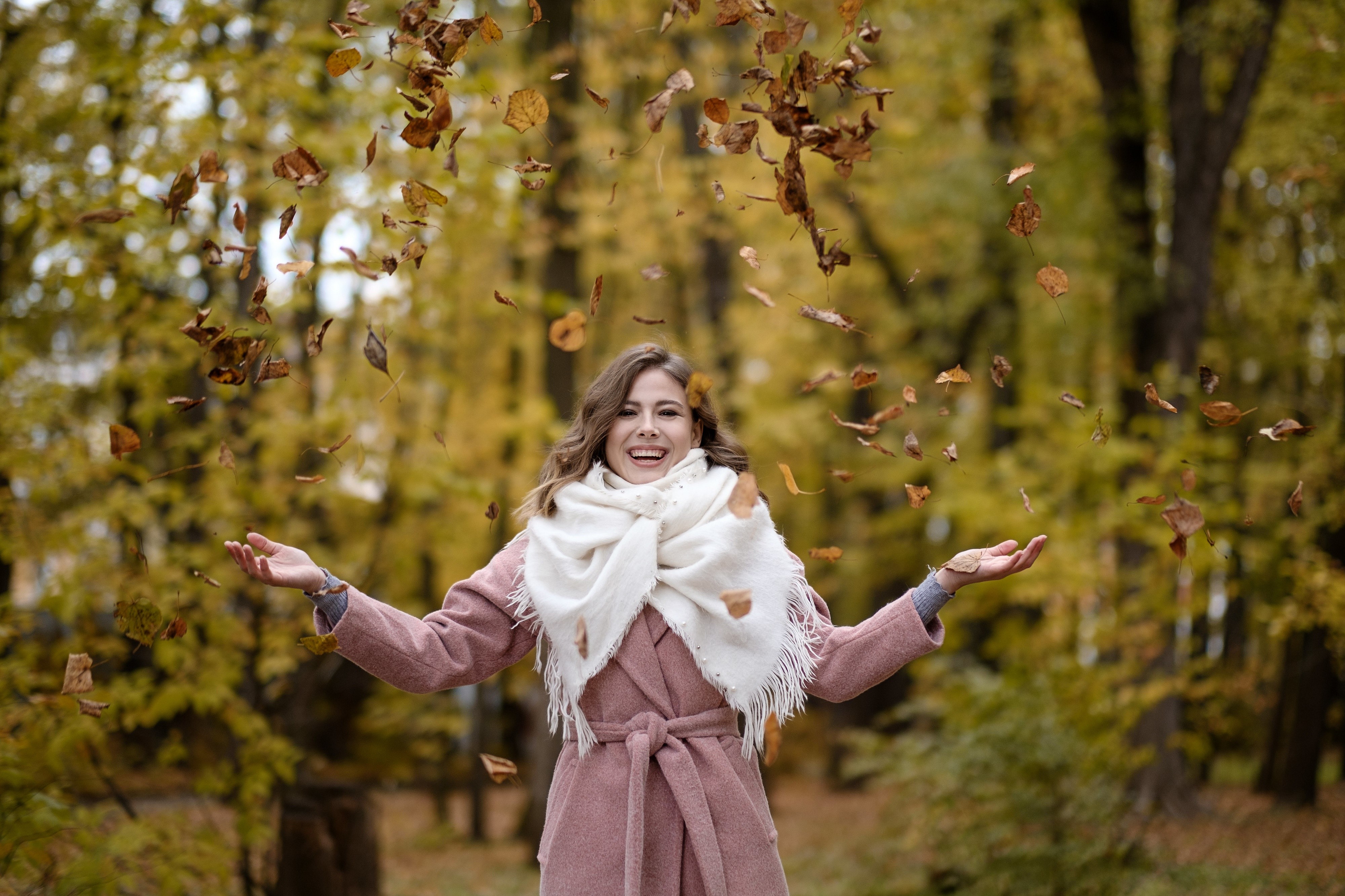 Woman throwing leaves in autumn park HD Wallpaper