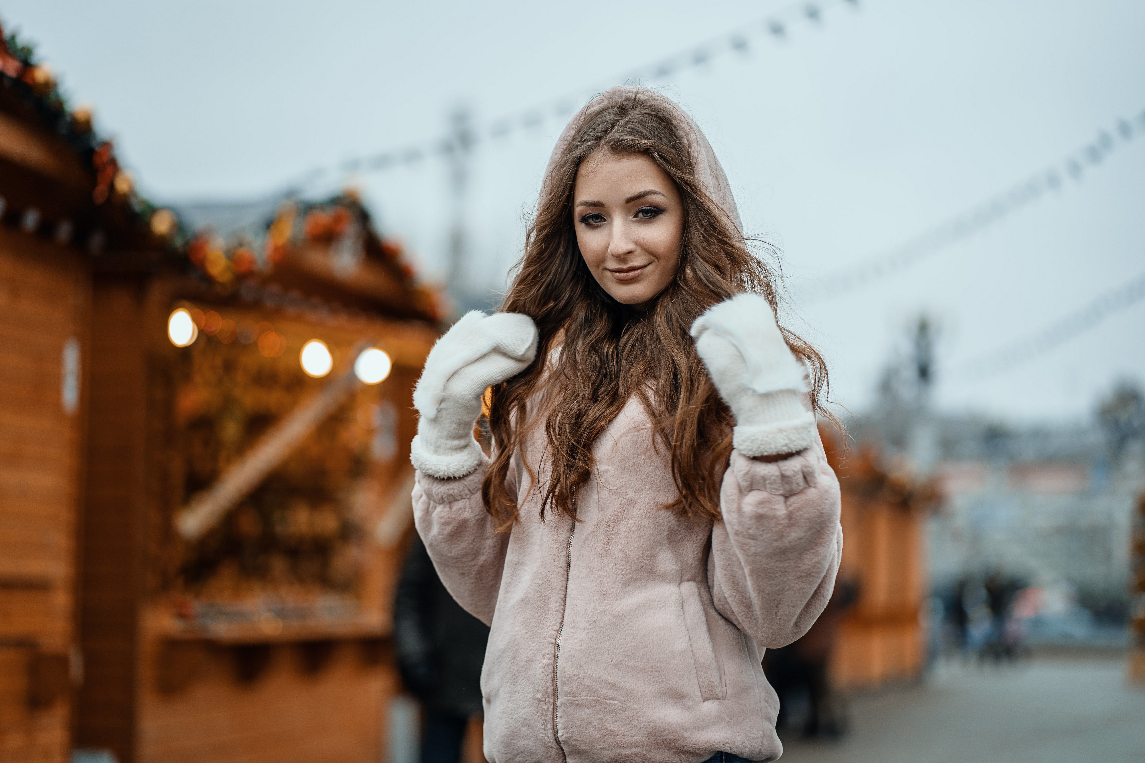Woman in jacket and mittens at market HD Wallpaper