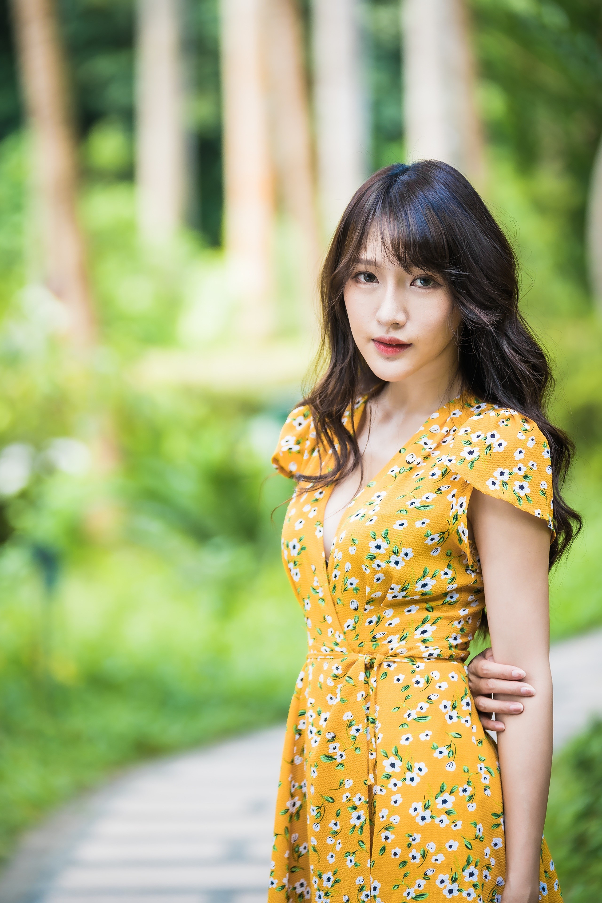 Brunette girl in yellow floral dress HD Phone Wallpaper