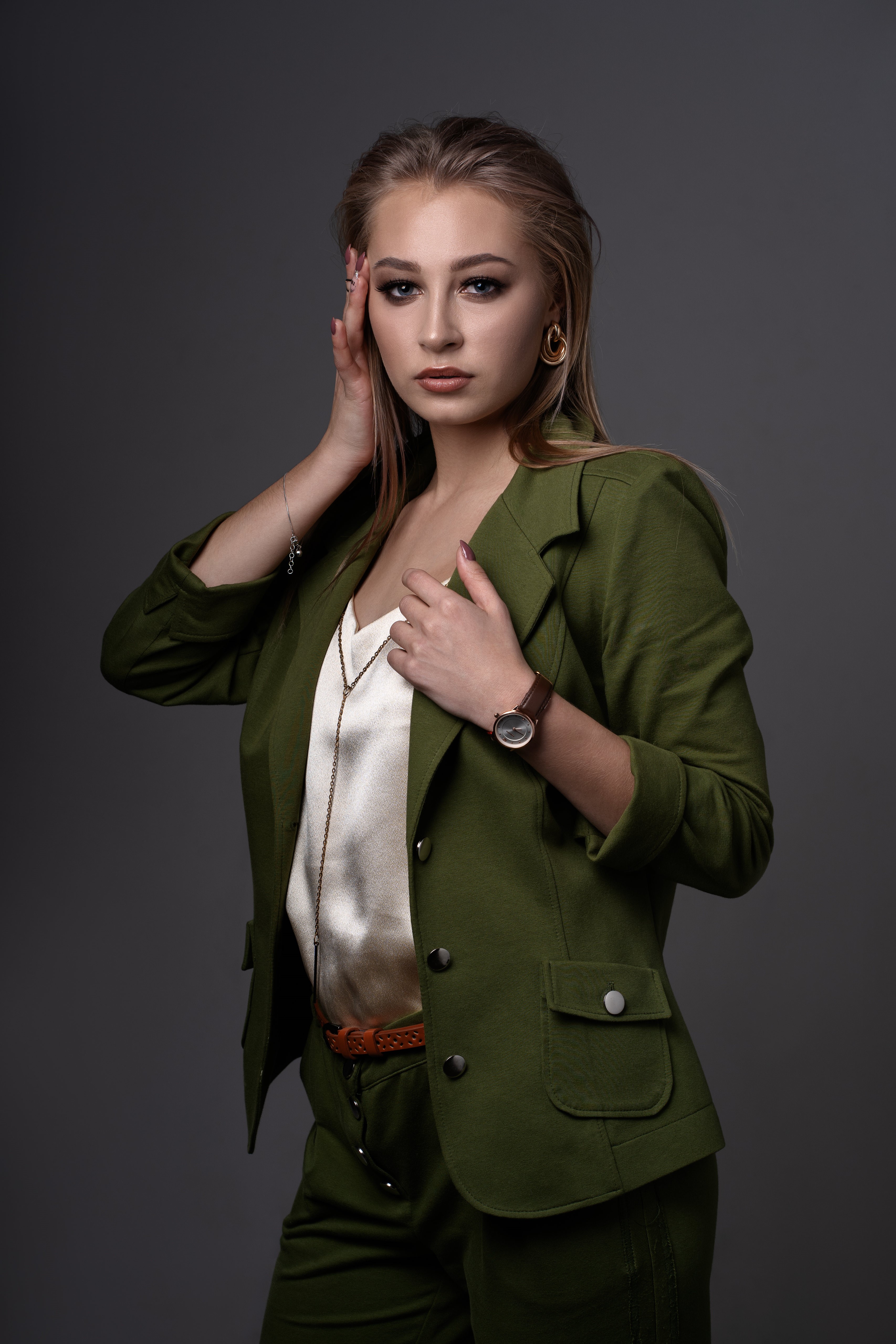 Woman in green suit posing HD Phone Wallpaper