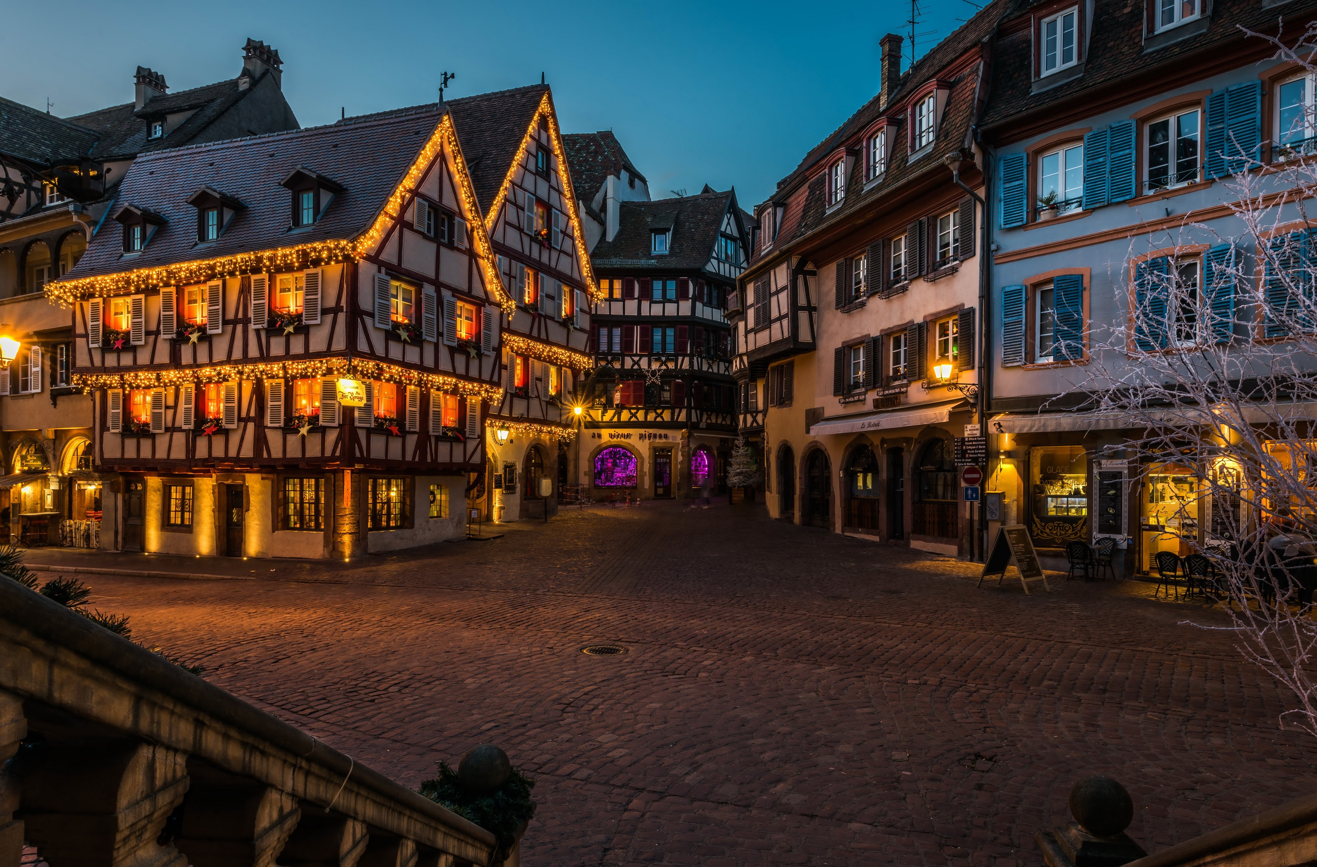 Christmas decorated houses in Colmar, France at dusk HD Wallpaper