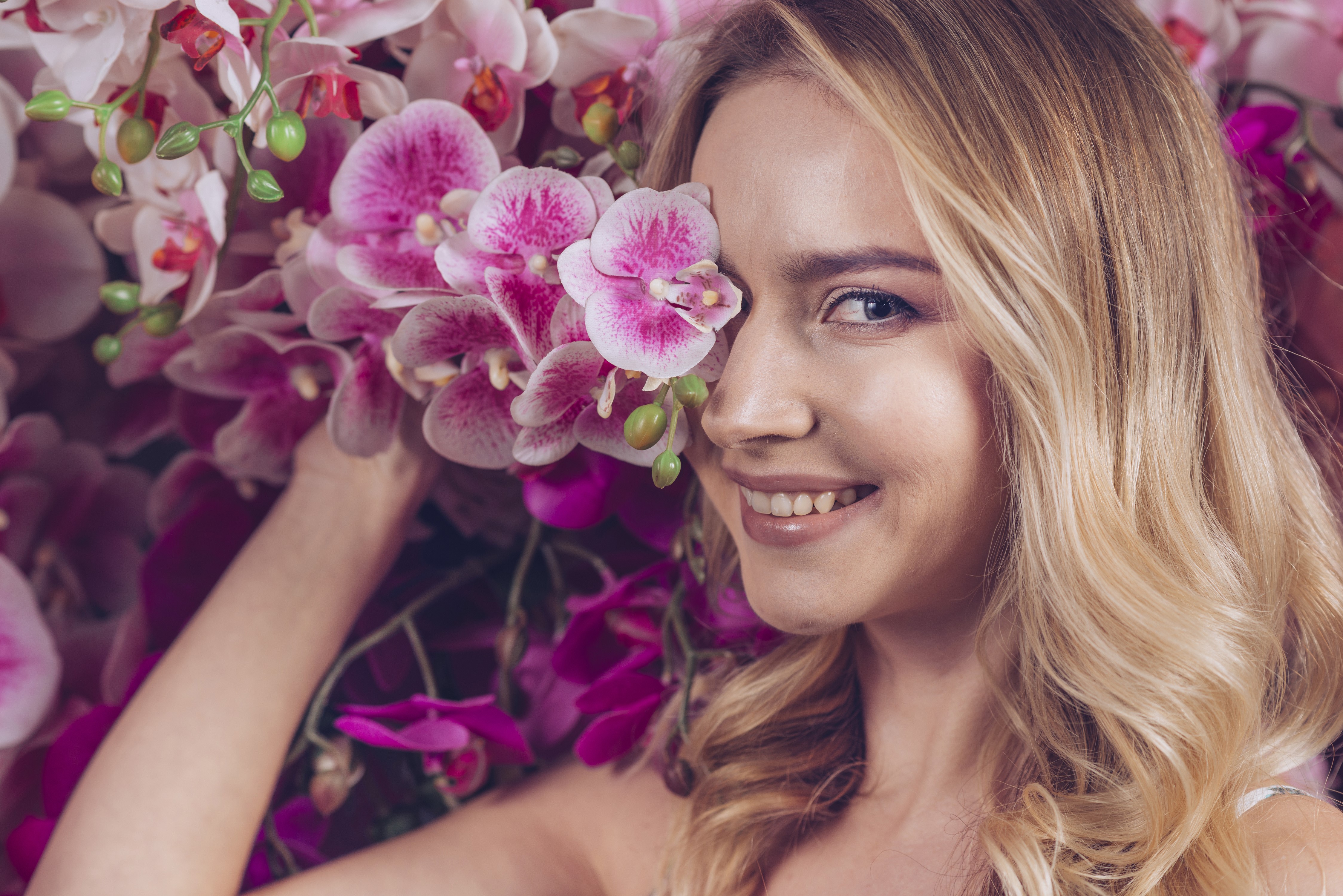Blonde girl with orchids HD Wallpaper
