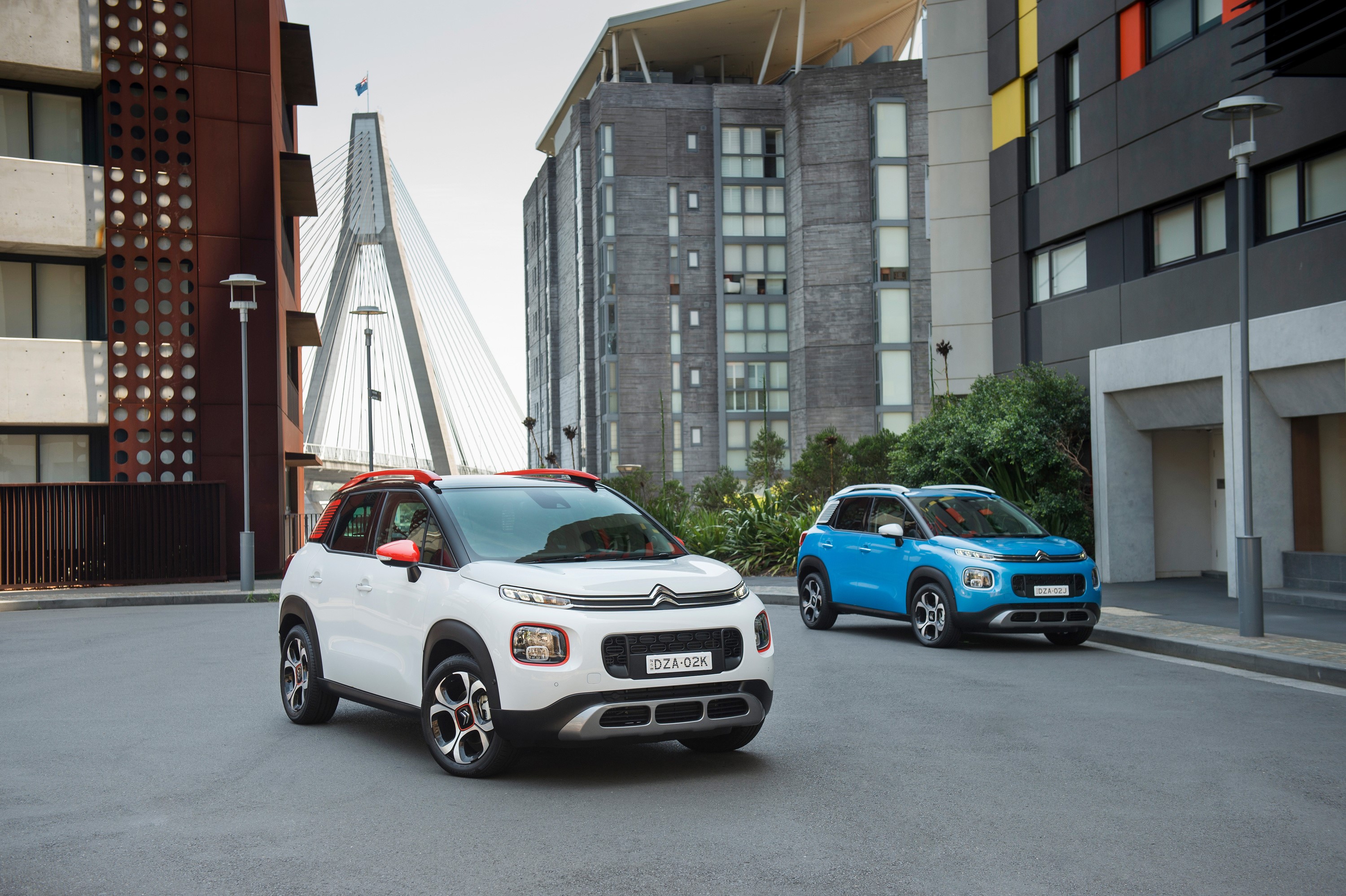 Two Citroen C3 Aircross cars parked on a street HD Wallpaper