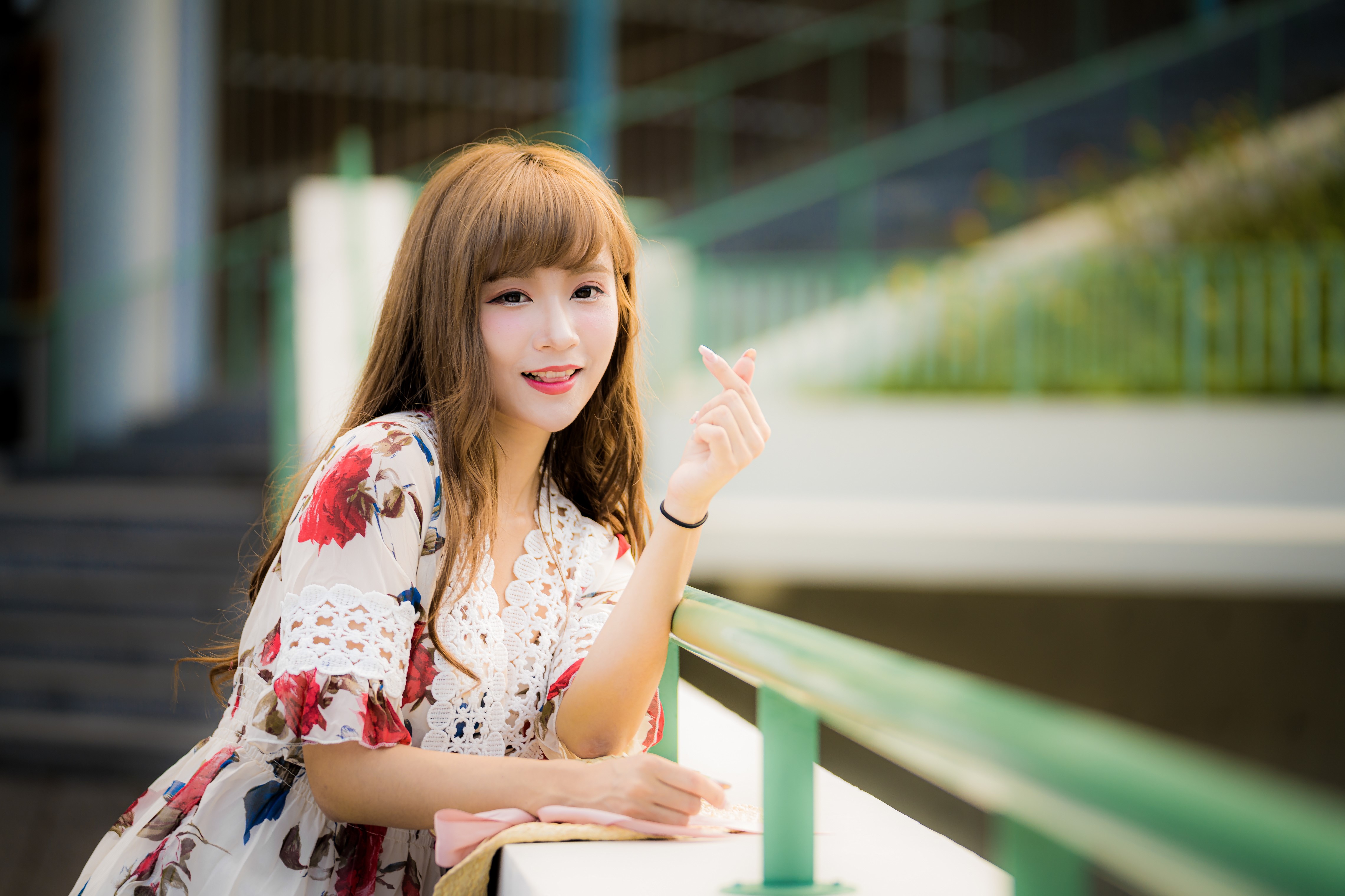 Asian woman with brown hair wearing a floral dress HD Wallpaper