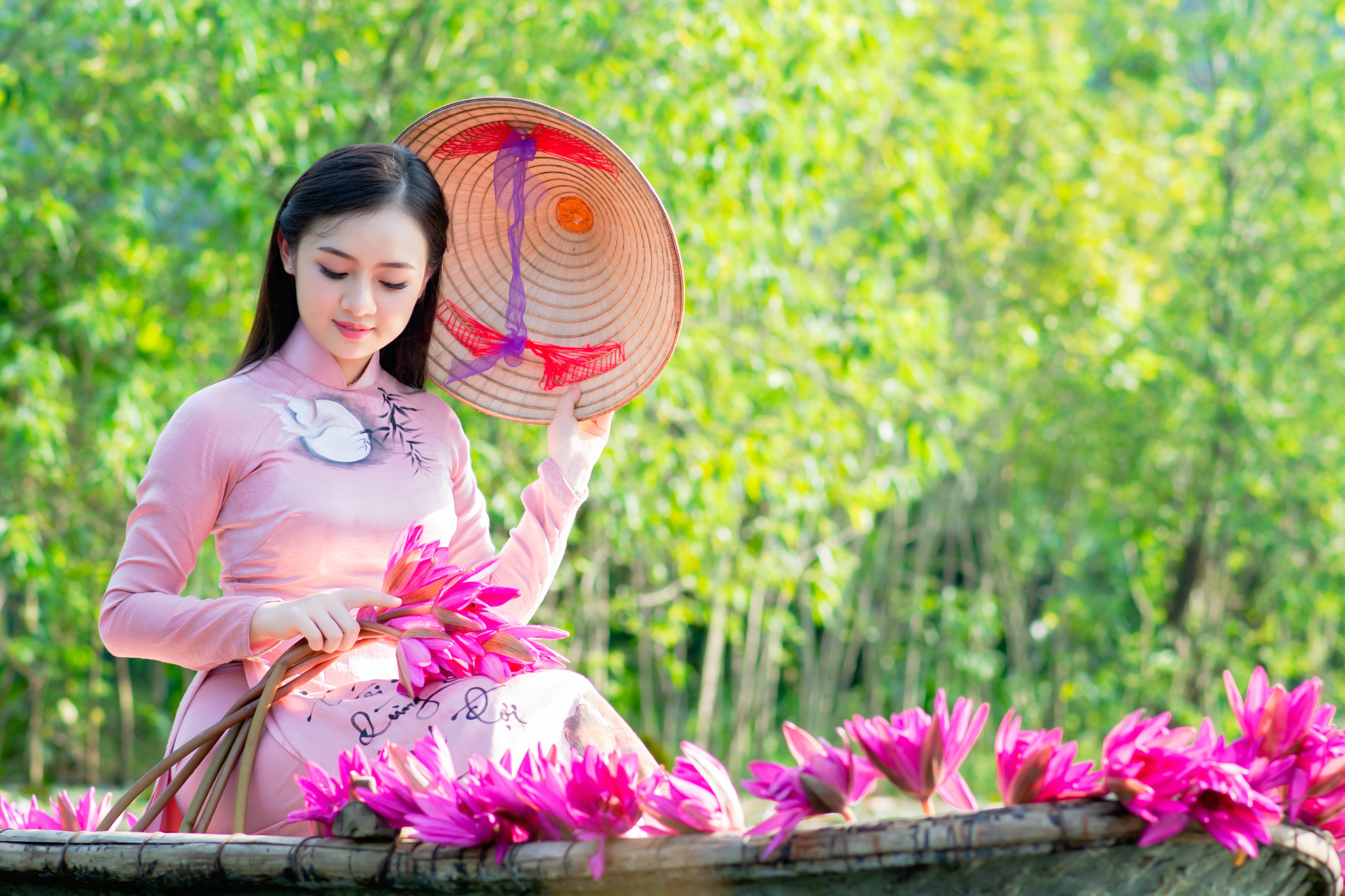 Brunette girl in pink dress with water lilies and hat HD Wallpaper