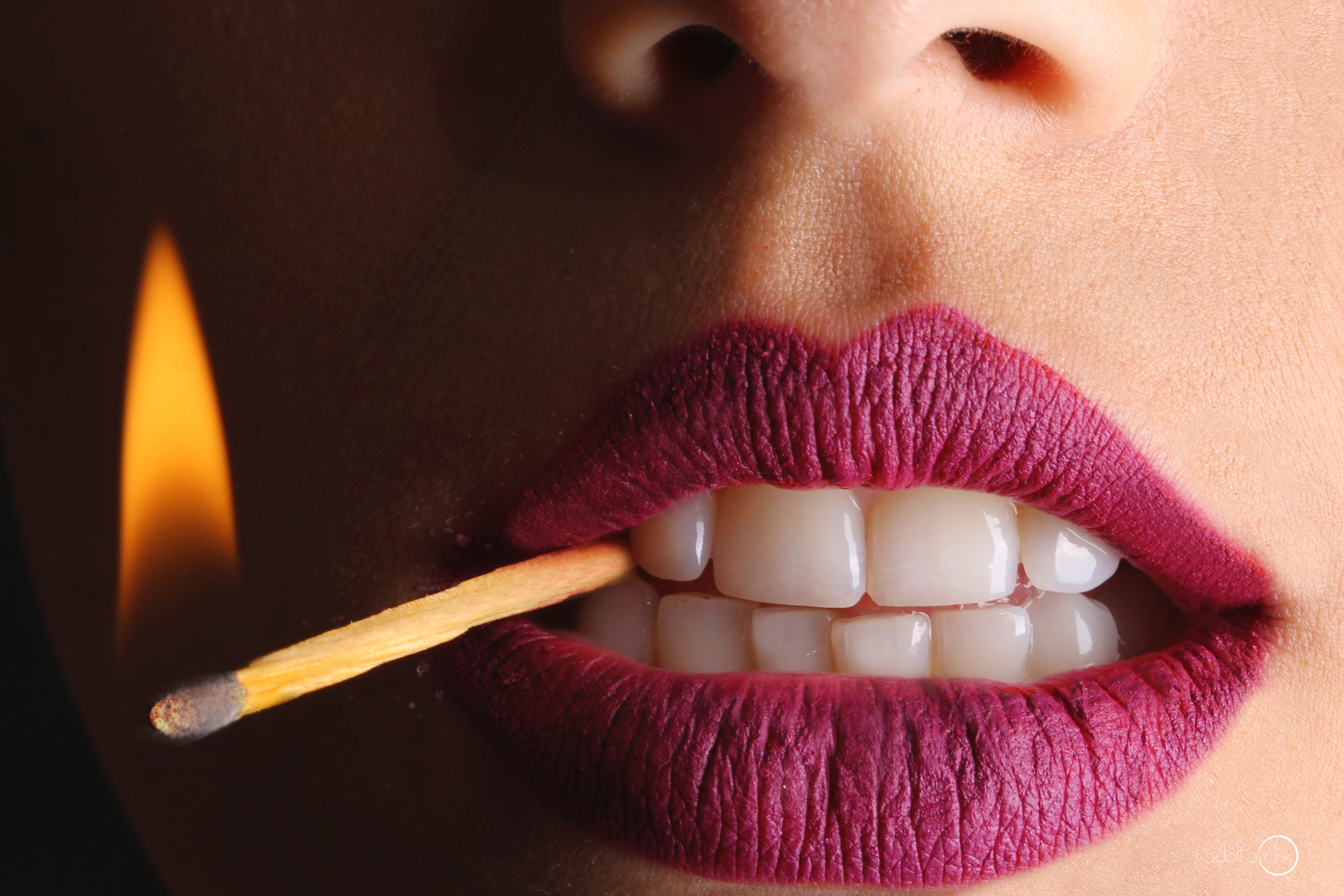 Close-up of lips with a lit match HD Wallpaper