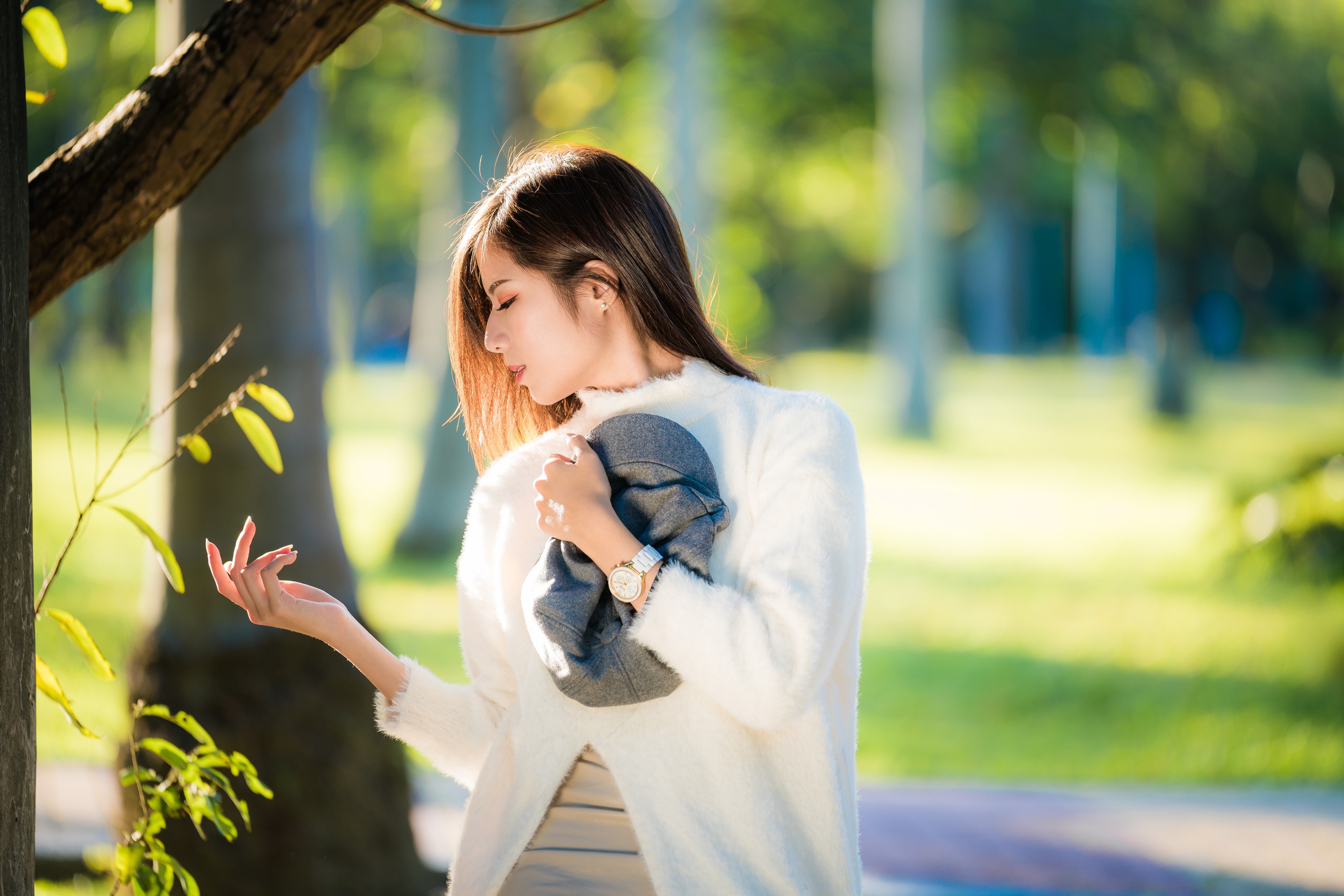 Asian woman in white sweater holding a hat HD Wallpaper