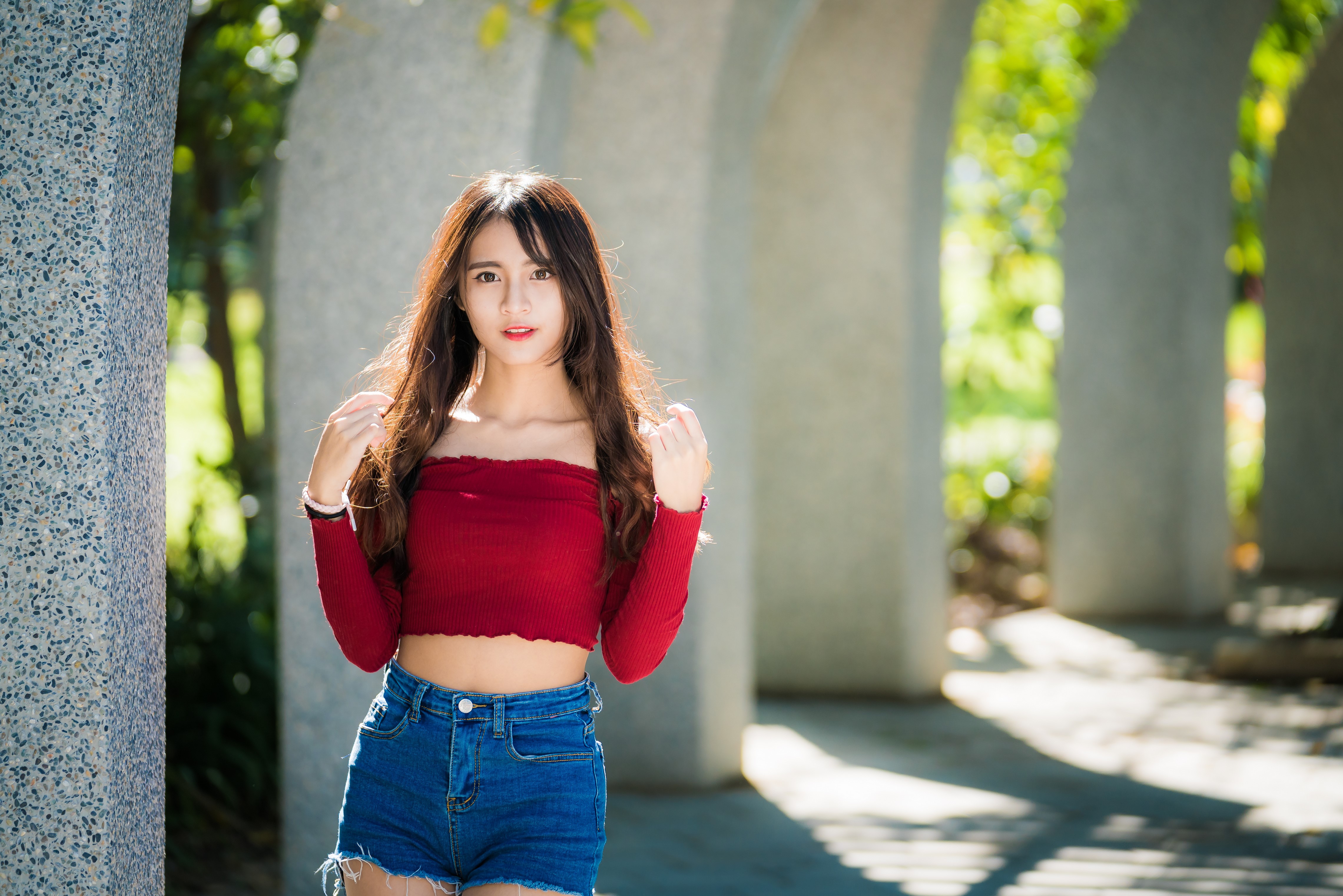 Asian woman with brown hair in a red top and denim shorts HD Wallpaper