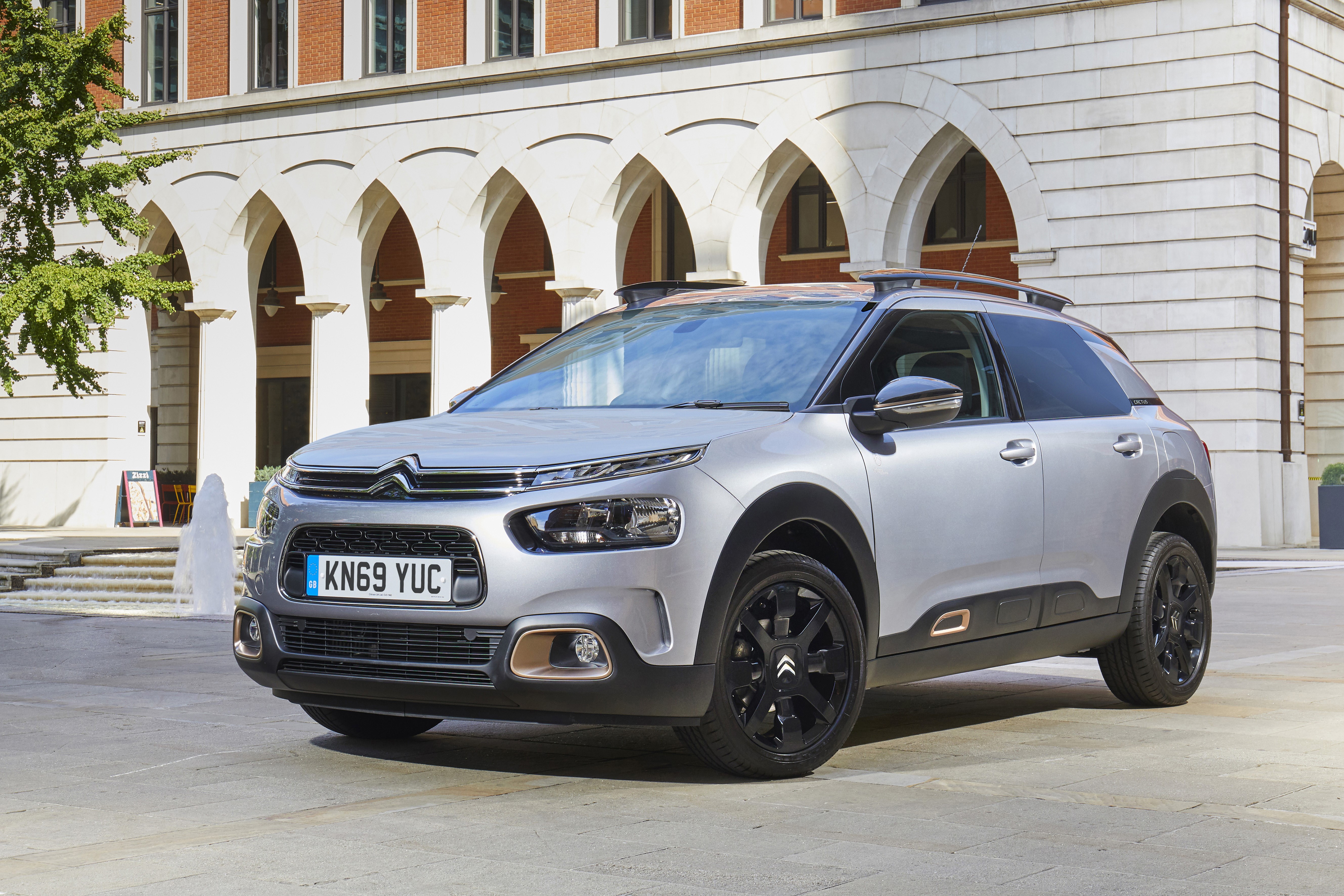 Silver Citroen C4 Cactus parked in front of a building HD Wallpaper