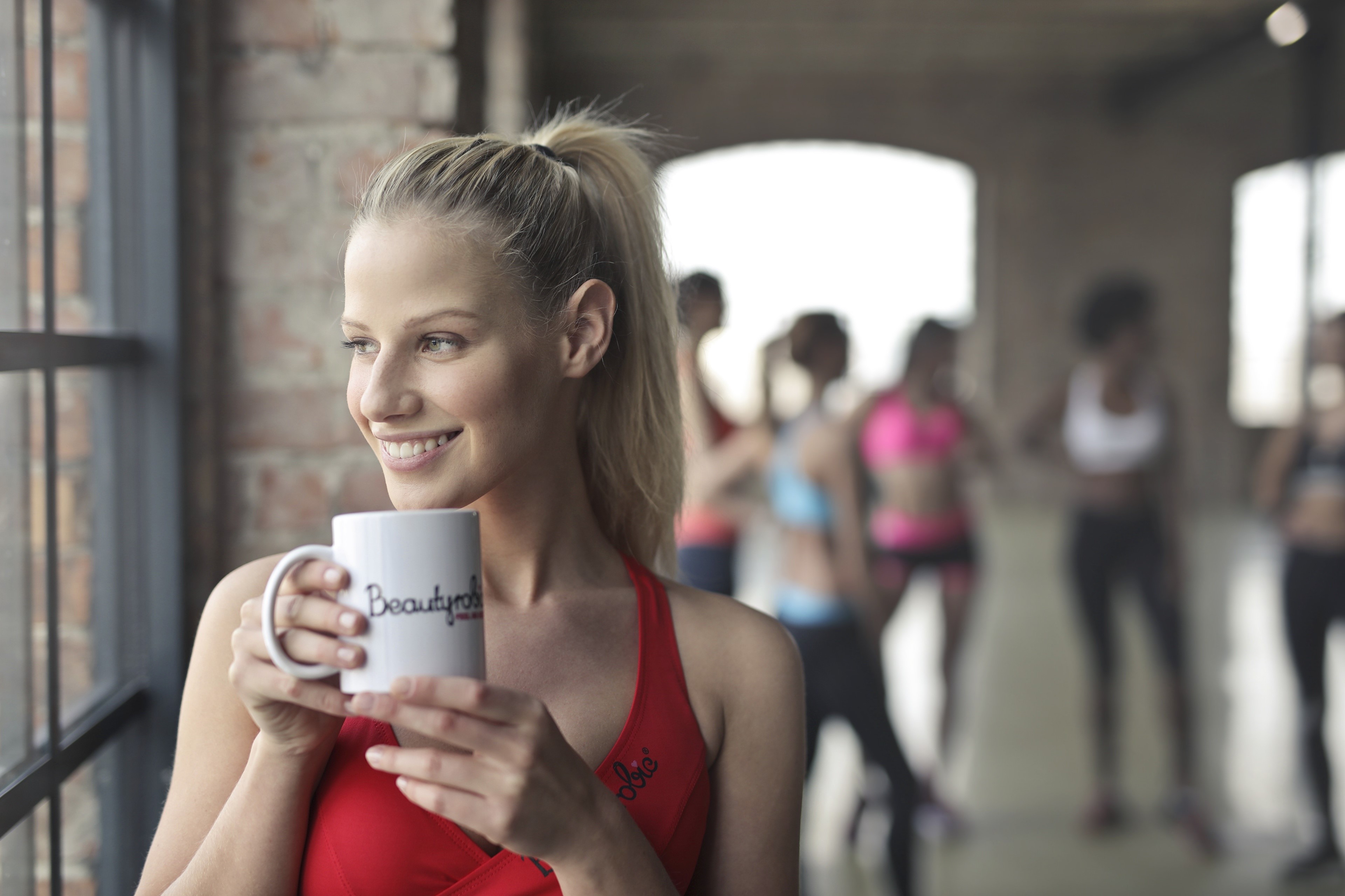 4K Fitness Blonde Girl Holding a Mug HD Wallpaper