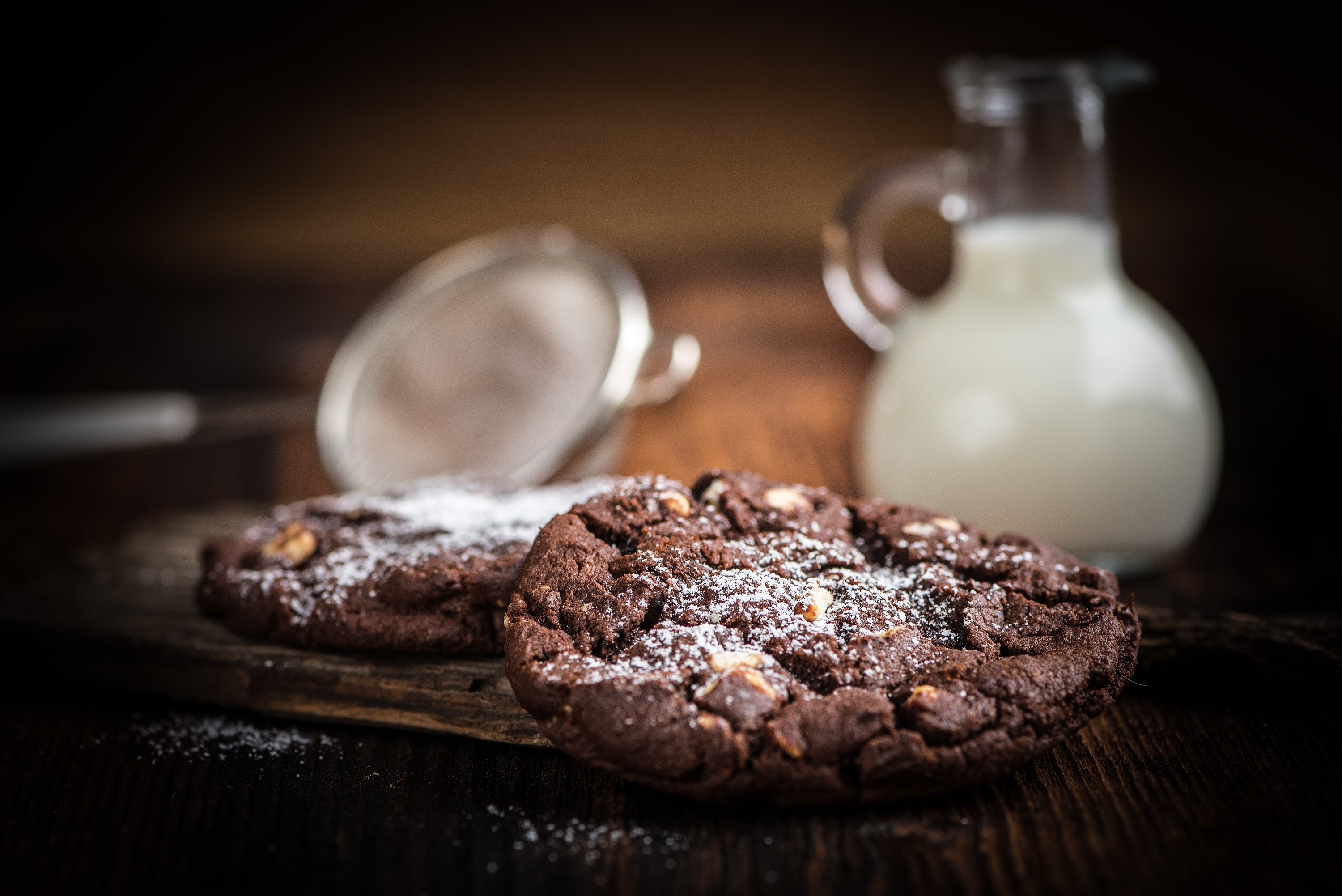 Chocolate cookies with powdered sugar and milk HD Wallpaper