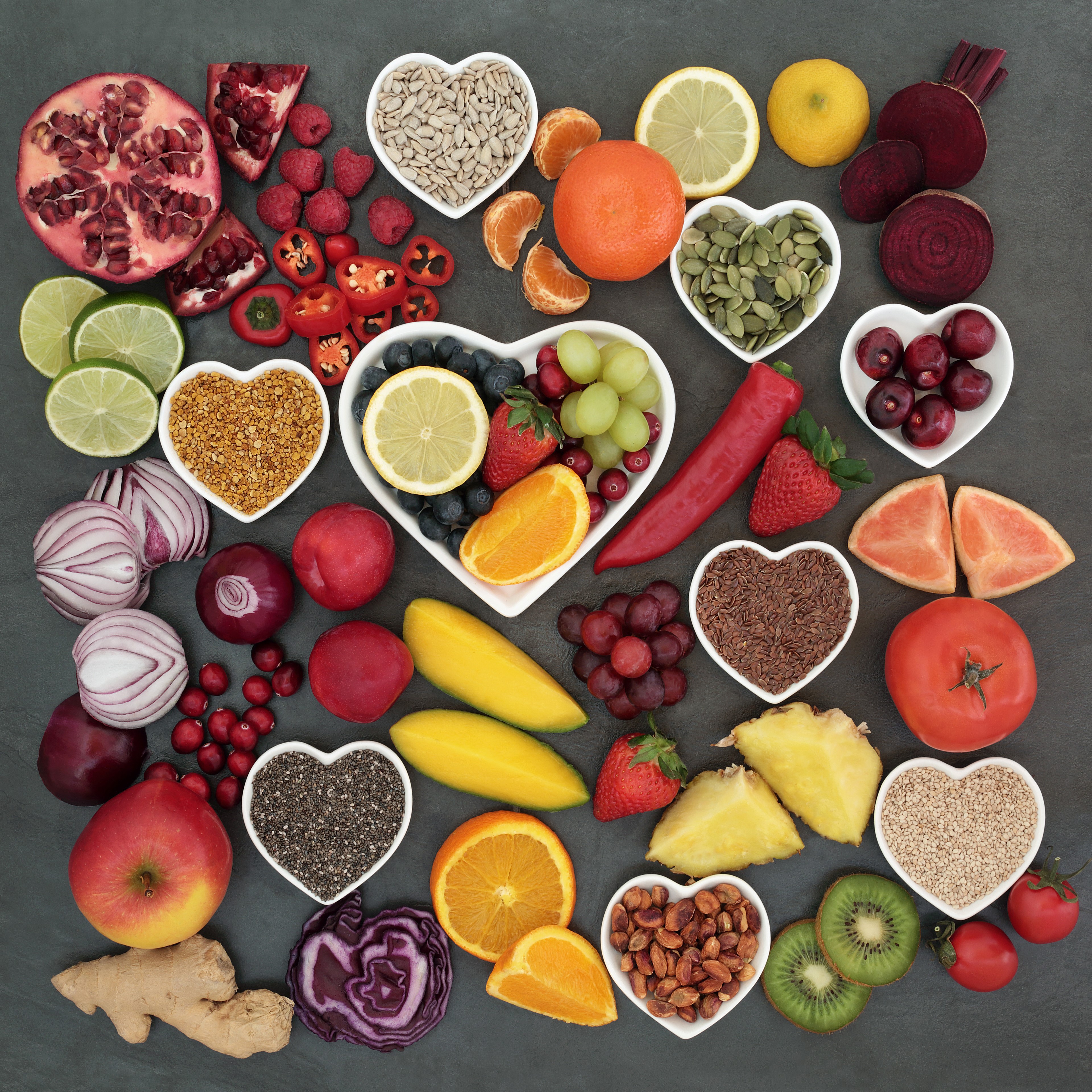 Heart-shaped bowls of healthy foods and fruits HD Wallpaper