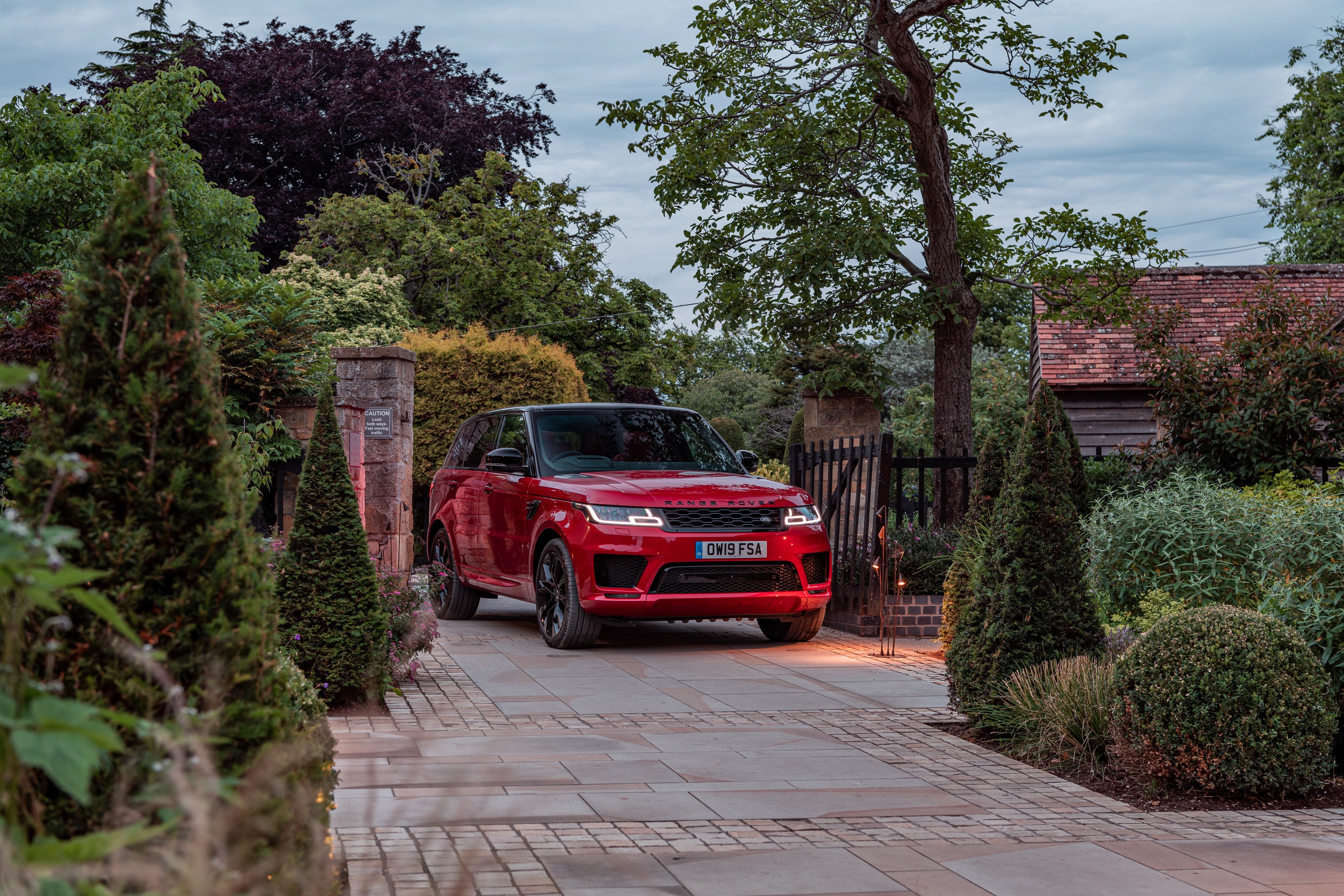 Red Range Rover Sport HST parked on a driveway HD Wallpaper