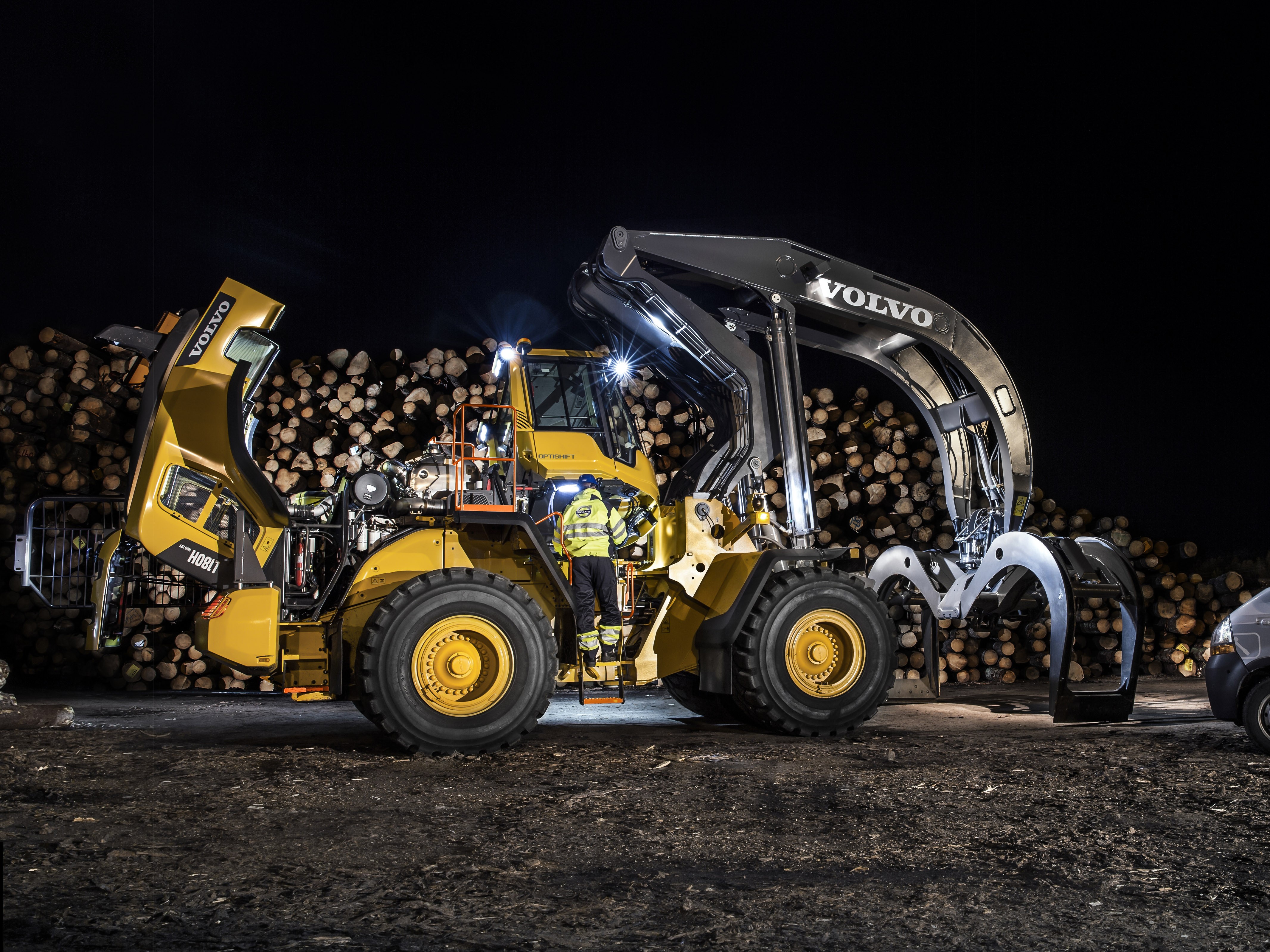 Volvo L180H High Lift Log Loader at Night HD Wallpaper