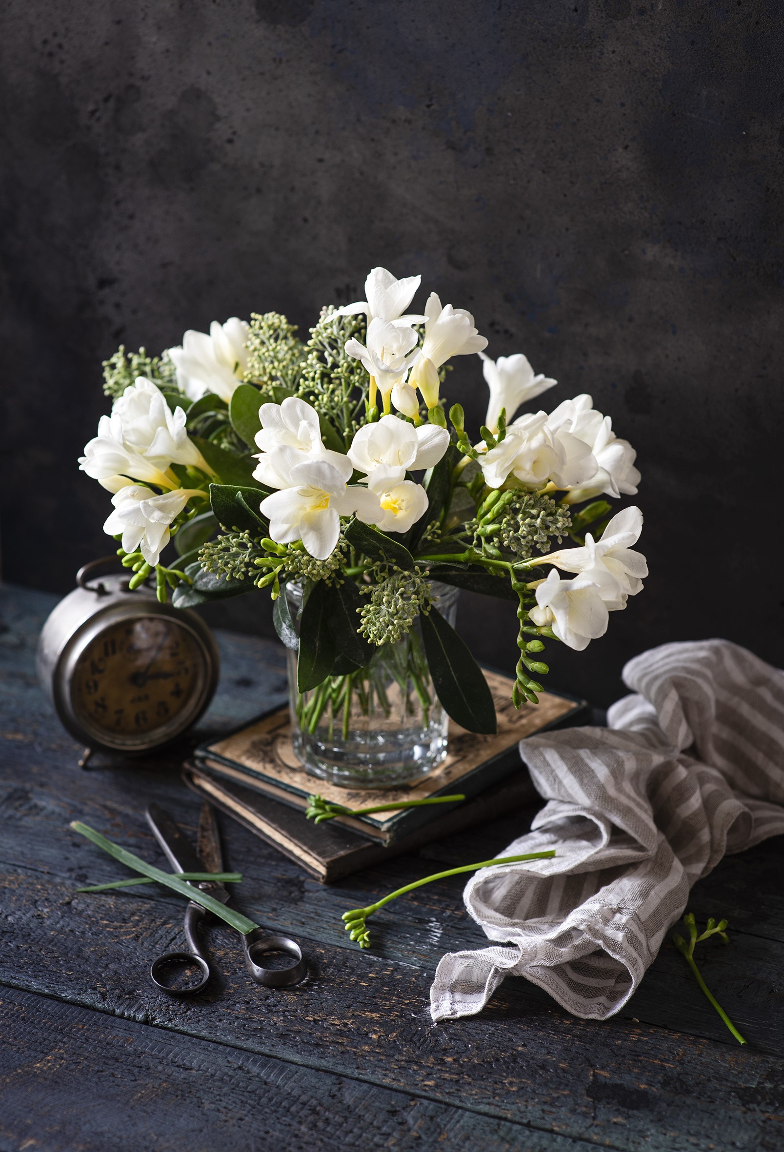White Freesia flowers in a vase with a clock HD Phone Wallpaper