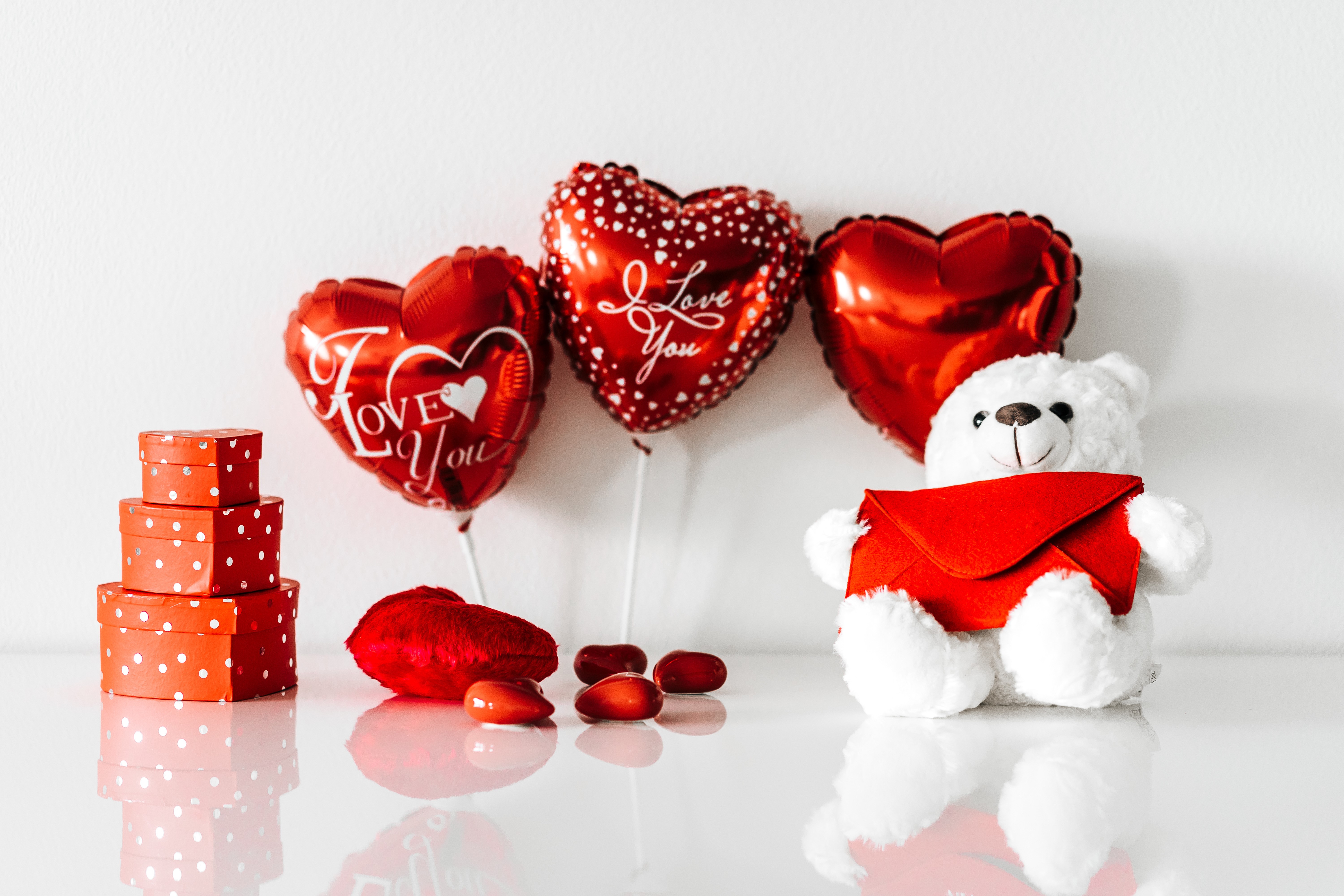 Valentine's Day teddy bear with heart balloons and gifts HD Wallpaper