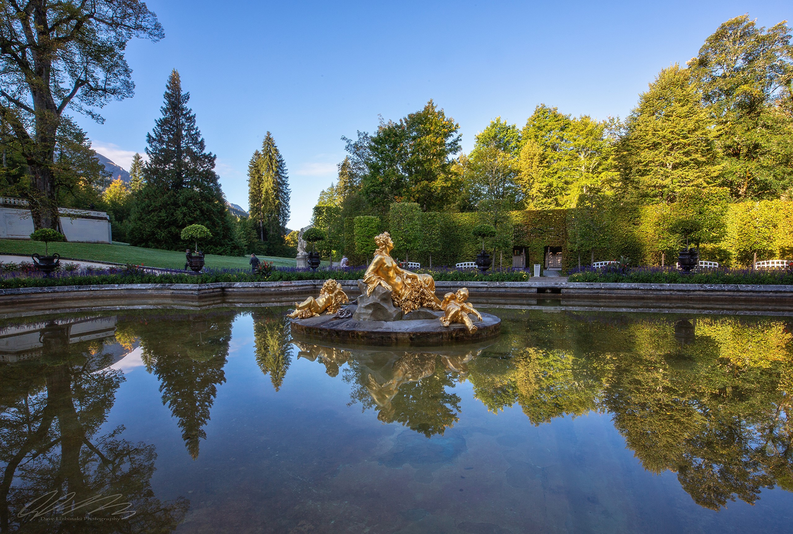 Golden fountain sculpture in a pond at Linderhof Palace park HD Wallpaper
