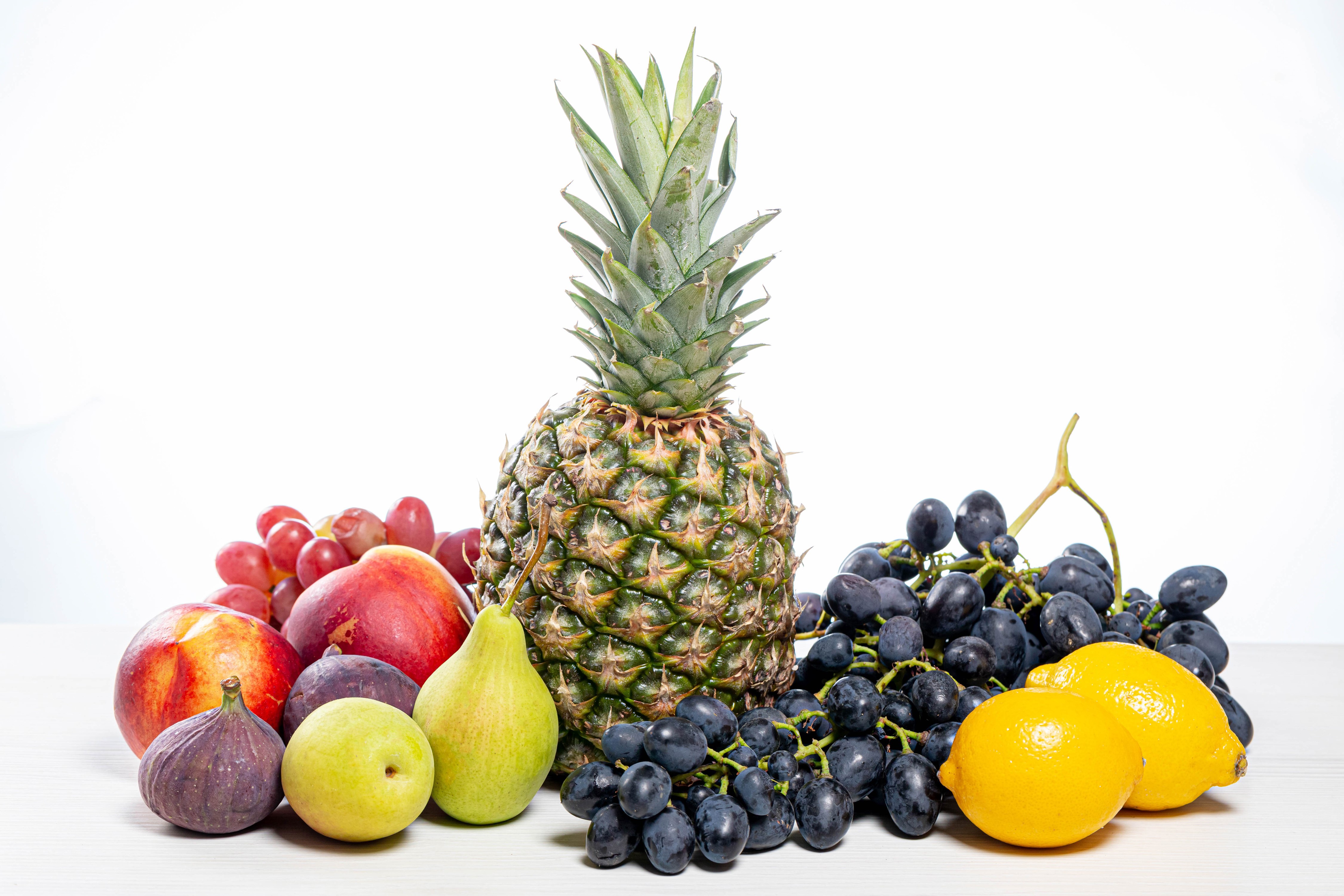 4K Fruit Assortment: Pineapple, Grapes, Lemons, Pears, Figs, Peaches HD Wallpaper