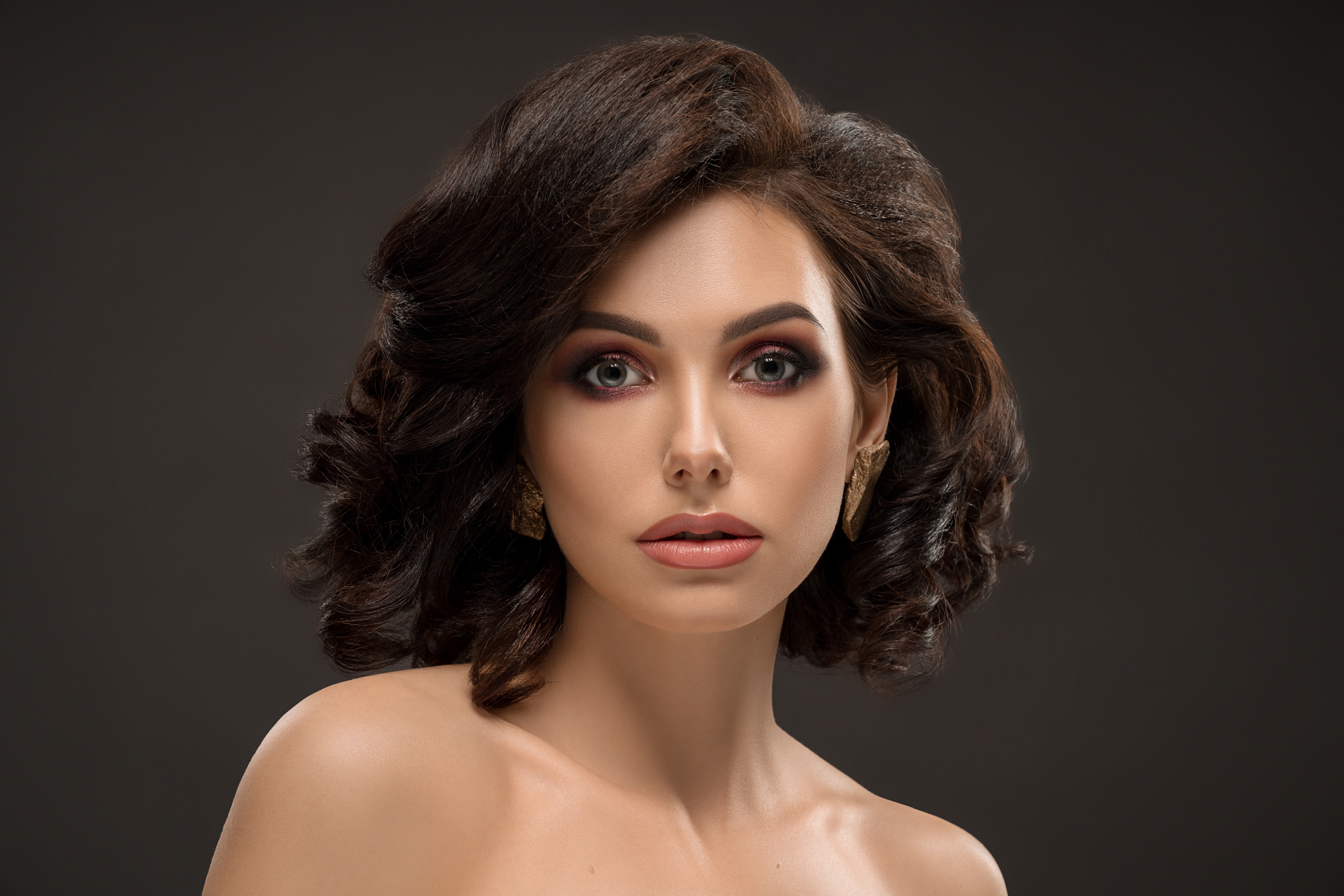 Woman with brown hair and makeup HD Wallpaper