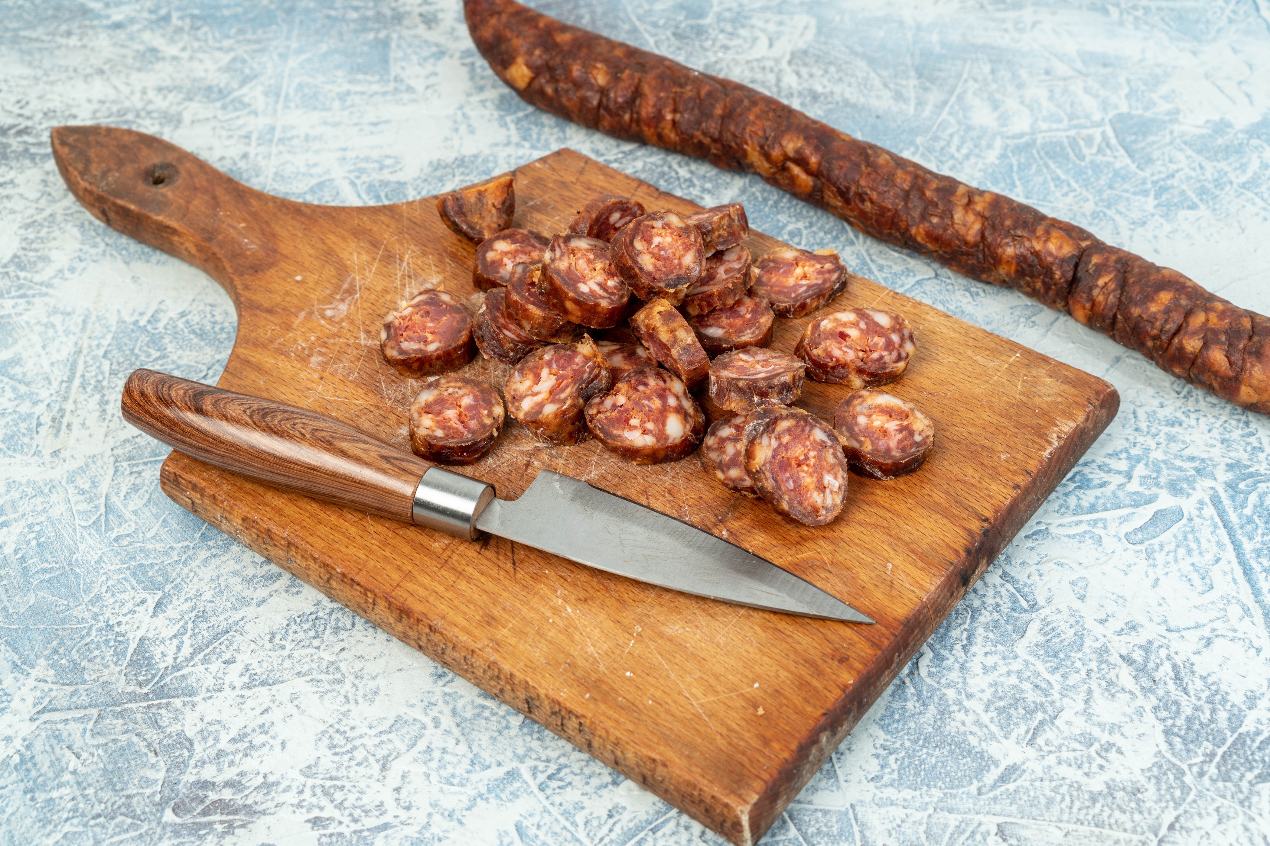 Sliced Sausage on Cutting Board with Knife HD Wallpaper