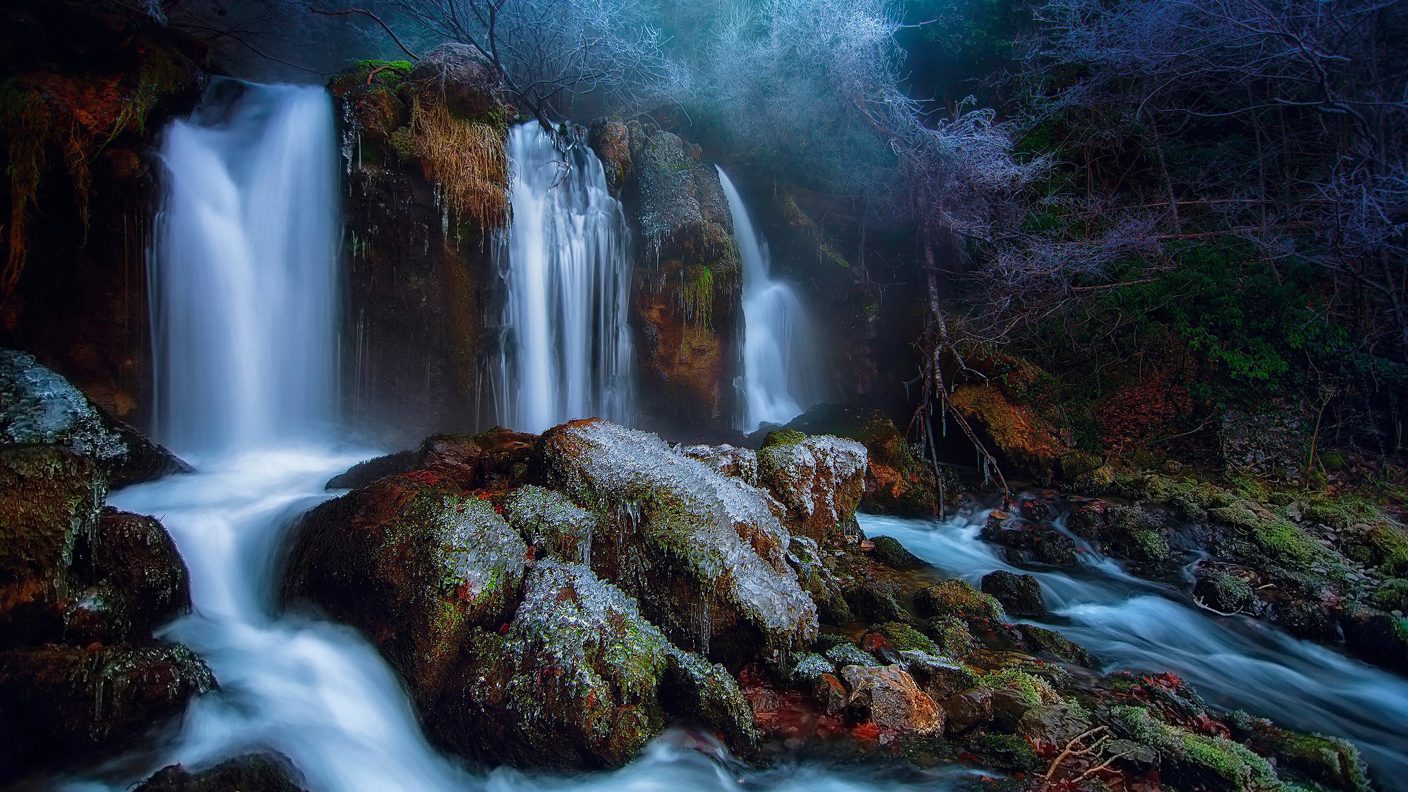 Frozen waterfall in a misty forest HD Wallpaper