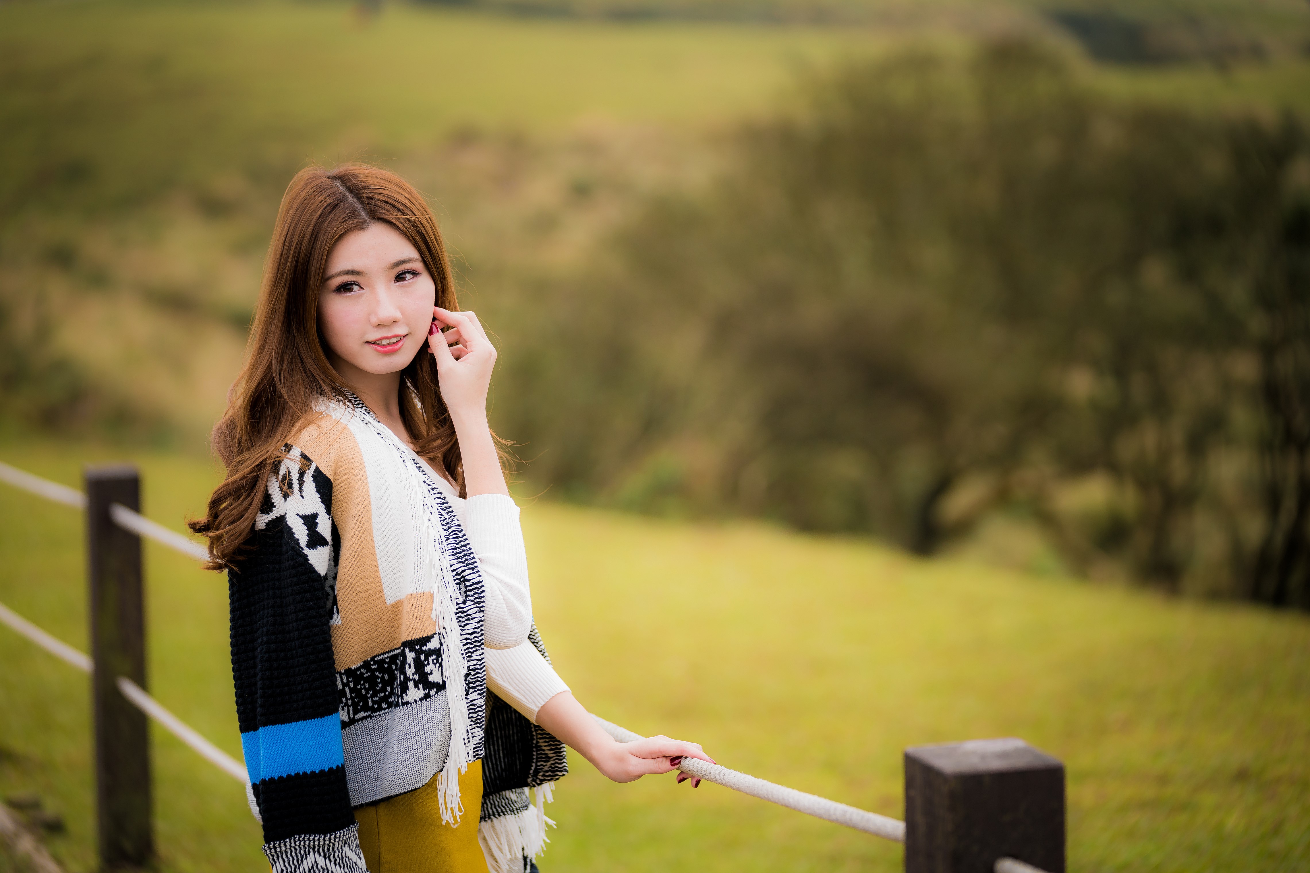 Beautiful Asian woman with brown hair in a colorful cardigan HD Wallpaper