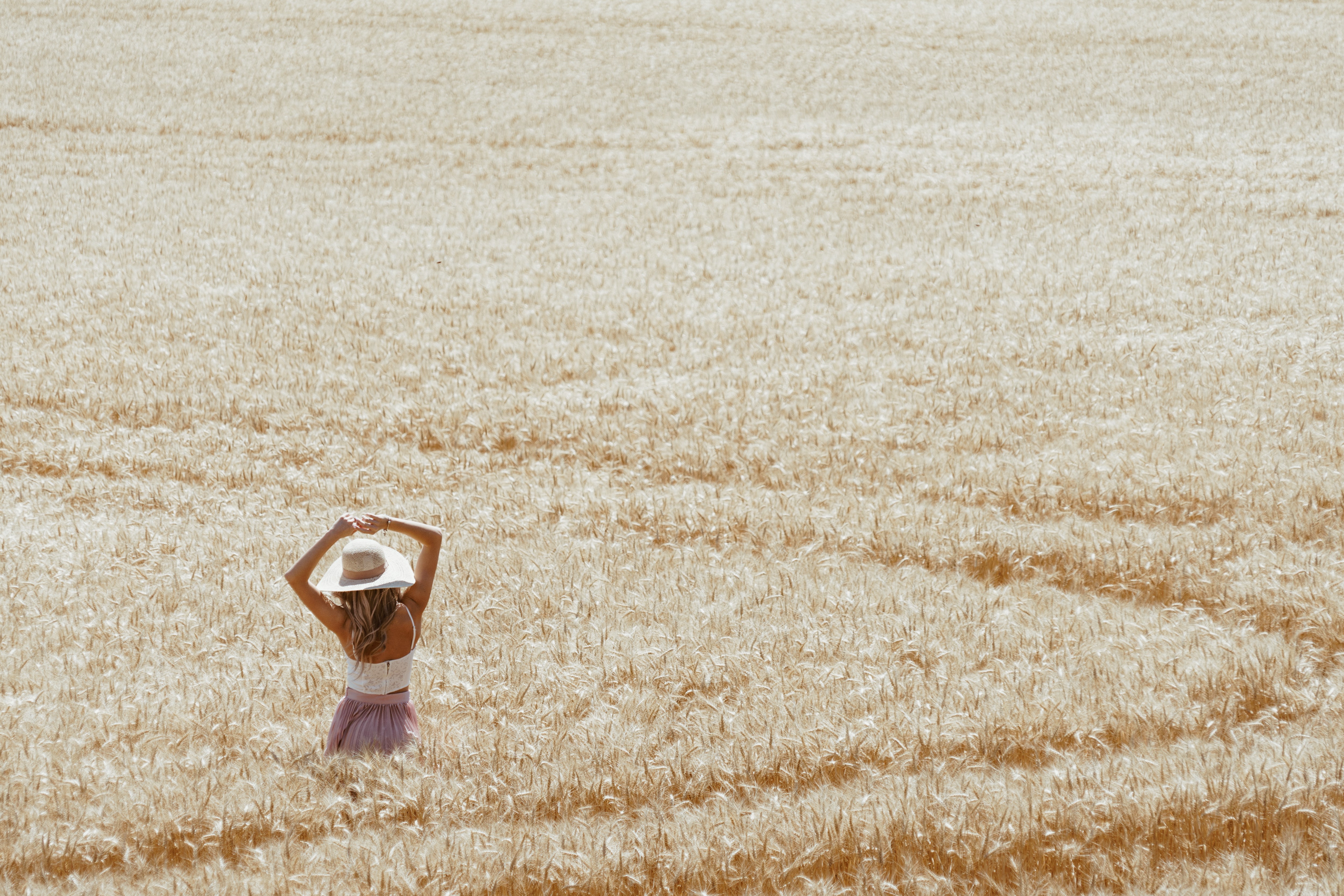 Woman in a straw hat in a wheat field HD Wallpaper