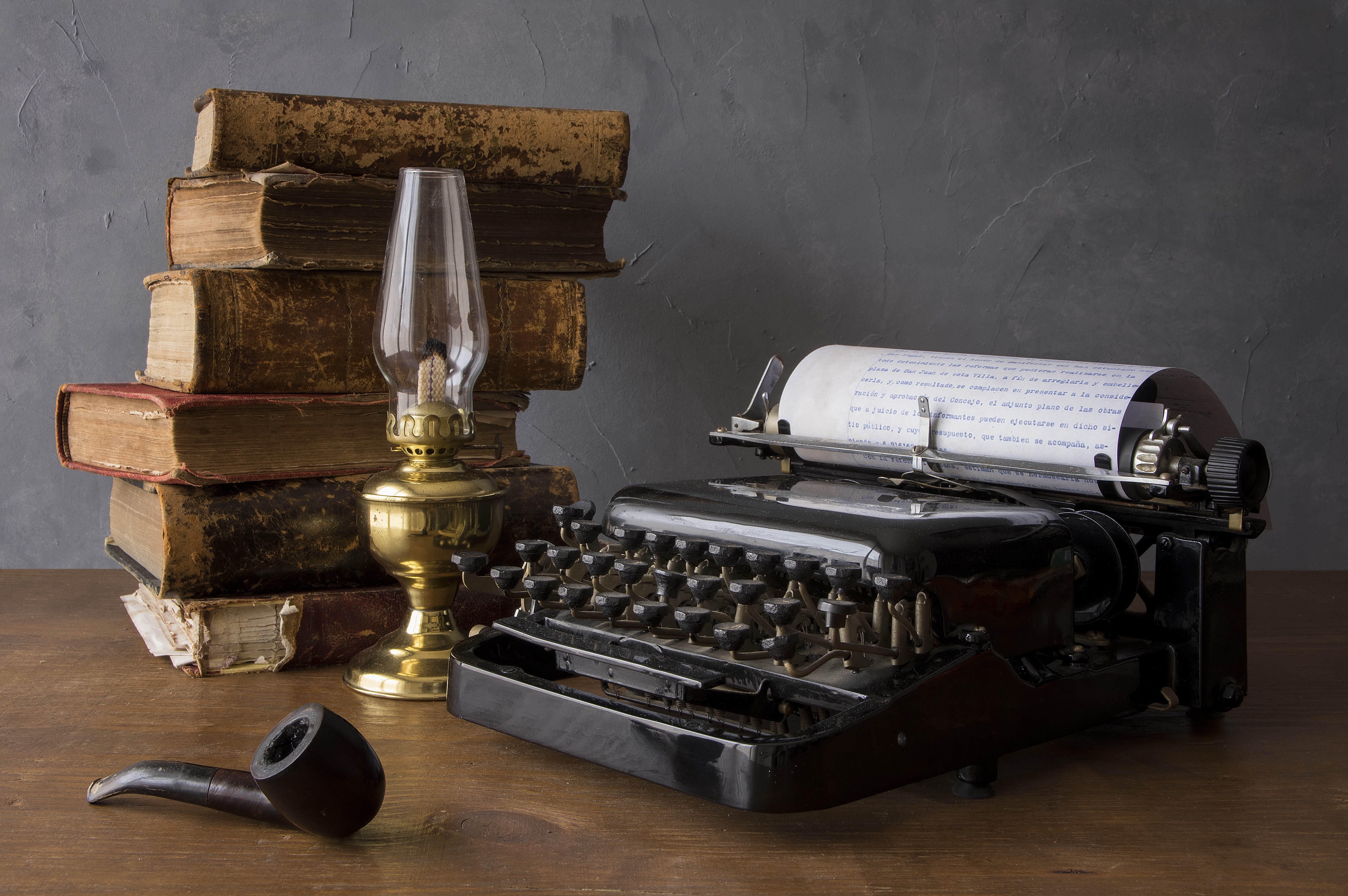 Typewriter, Kerosene Lamp, Books, and Pipe on Table HD Wallpaper