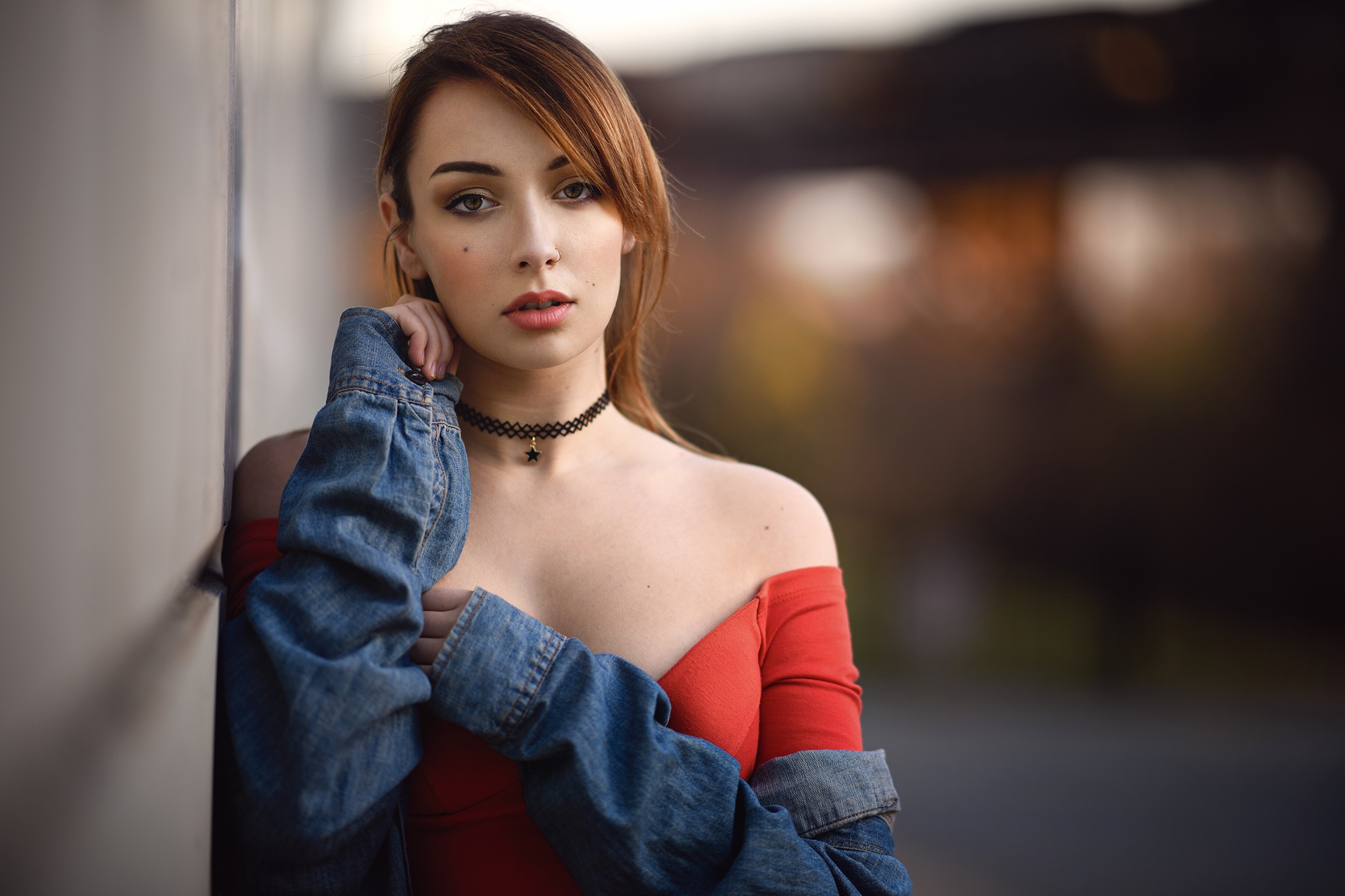 Woman with brown hair wearing a red top and denim jacket HD Wallpaper
