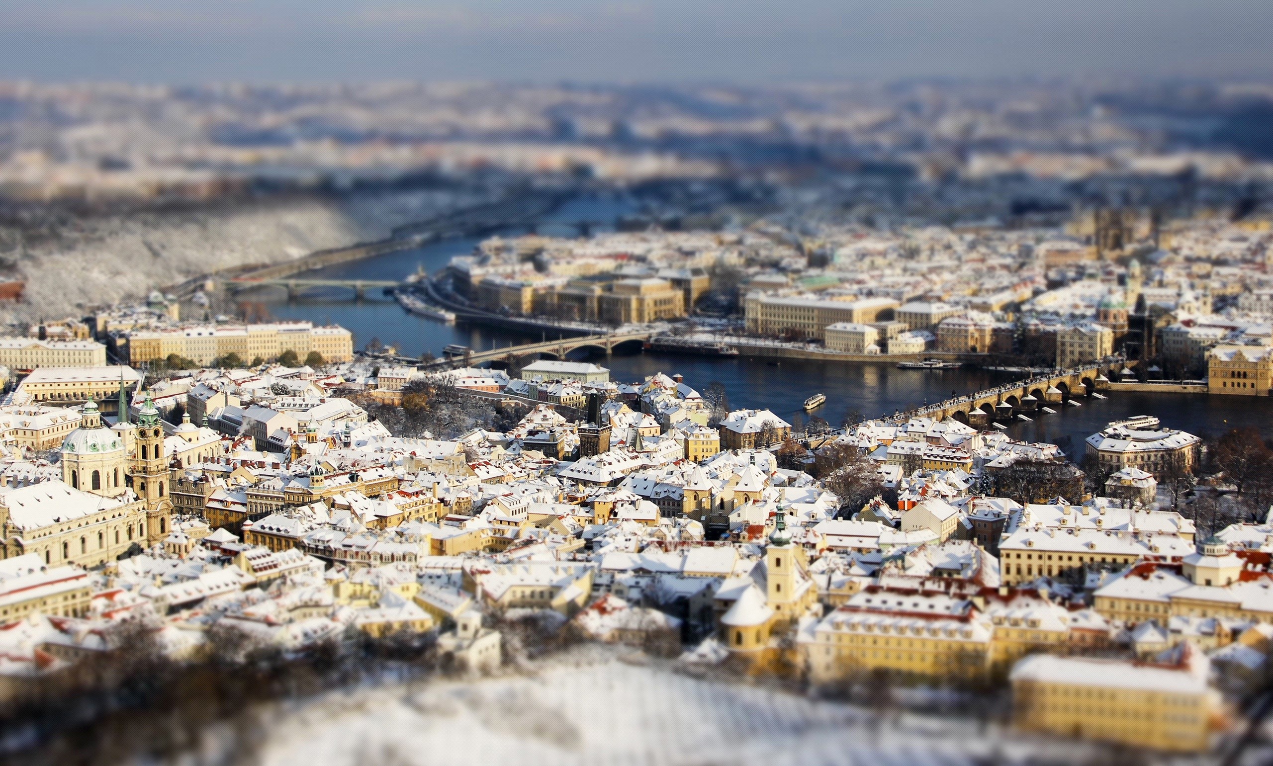Prague, Czech Republic covered in snow from above HD Wallpaper