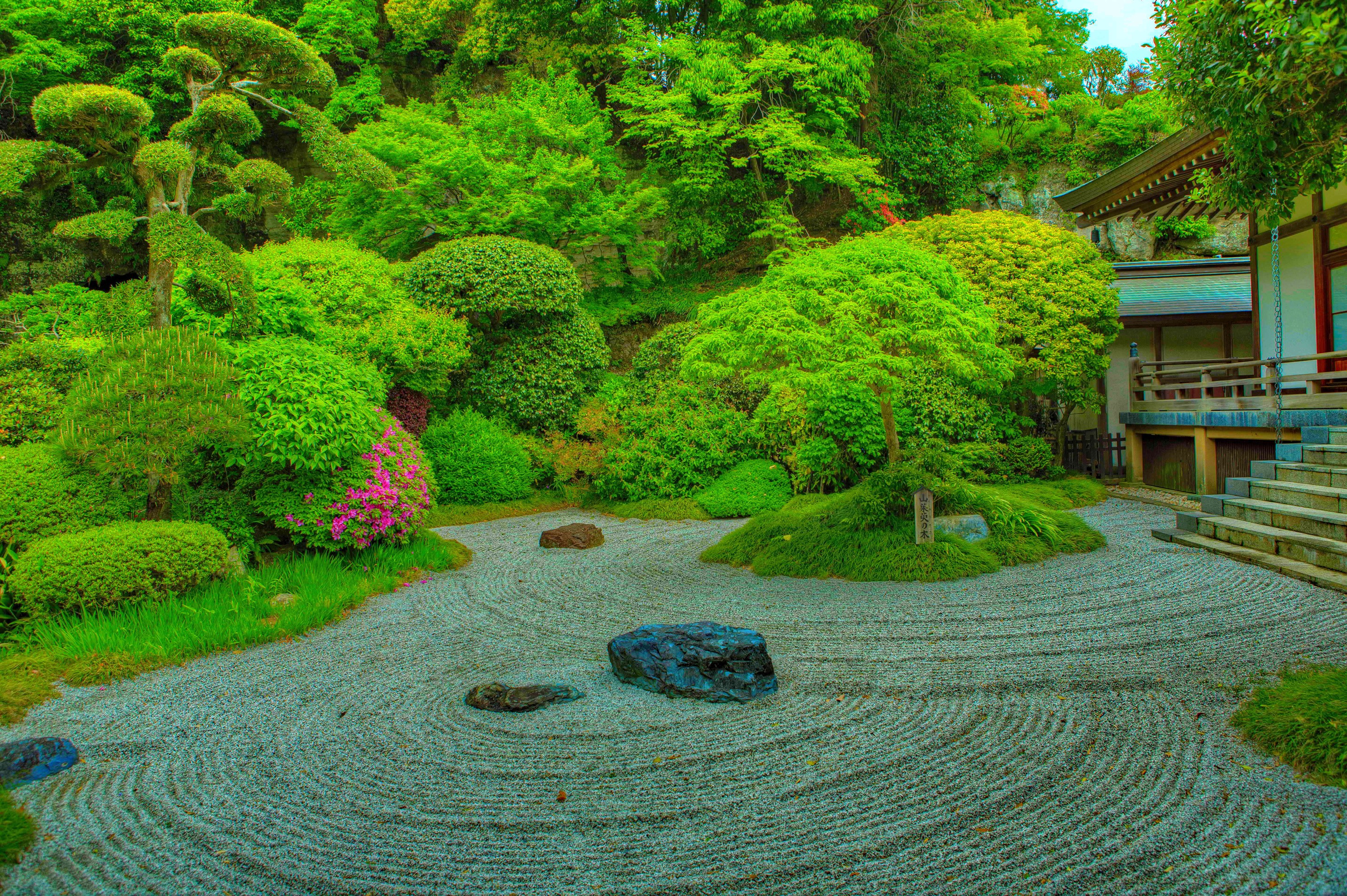 Zen garden with raked gravel and manicured trees in Kamakura, Japan HD Wallpaper