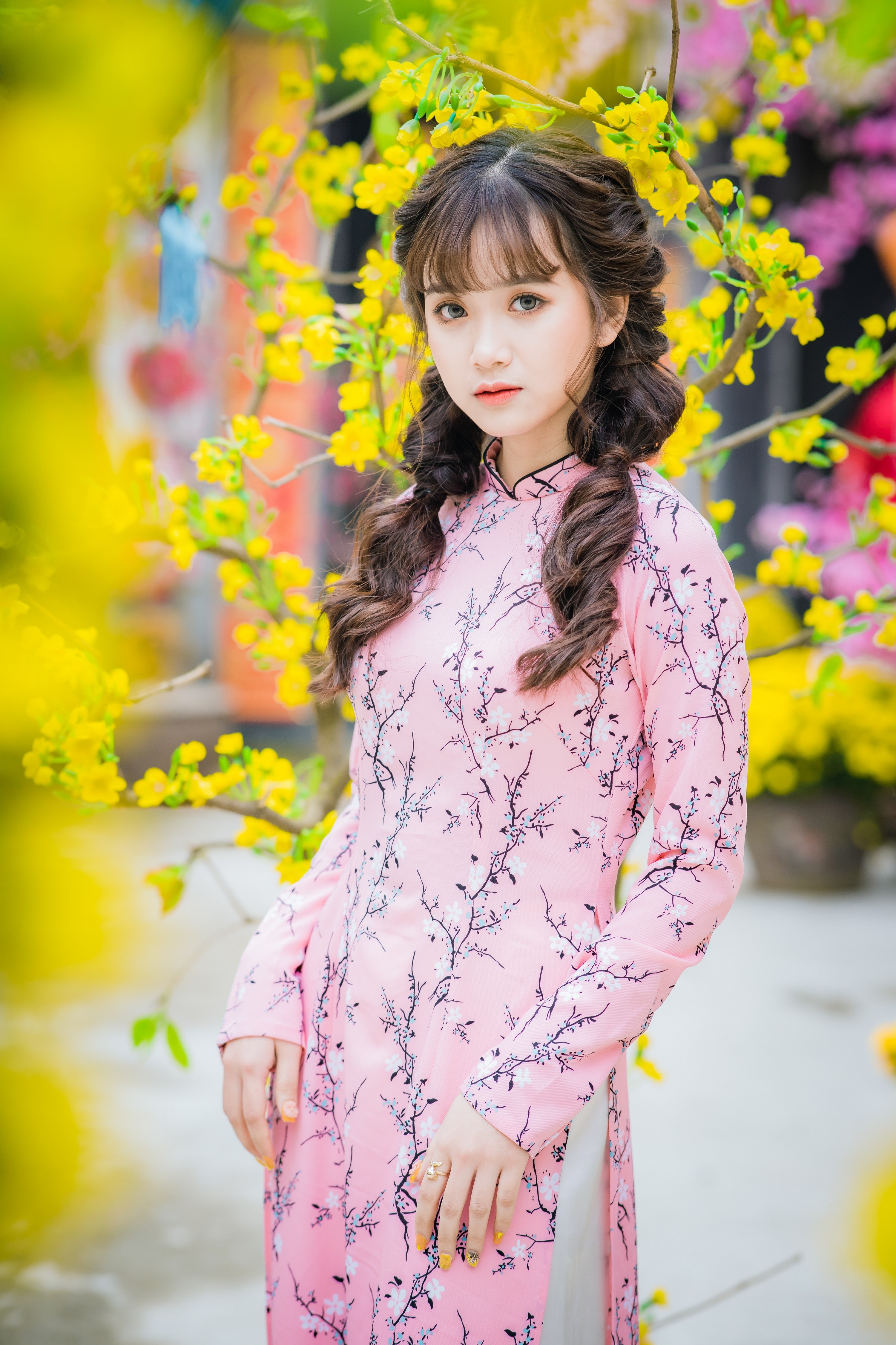 Young Asian woman in pink floral dress with pigtails HD Phone Wallpaper