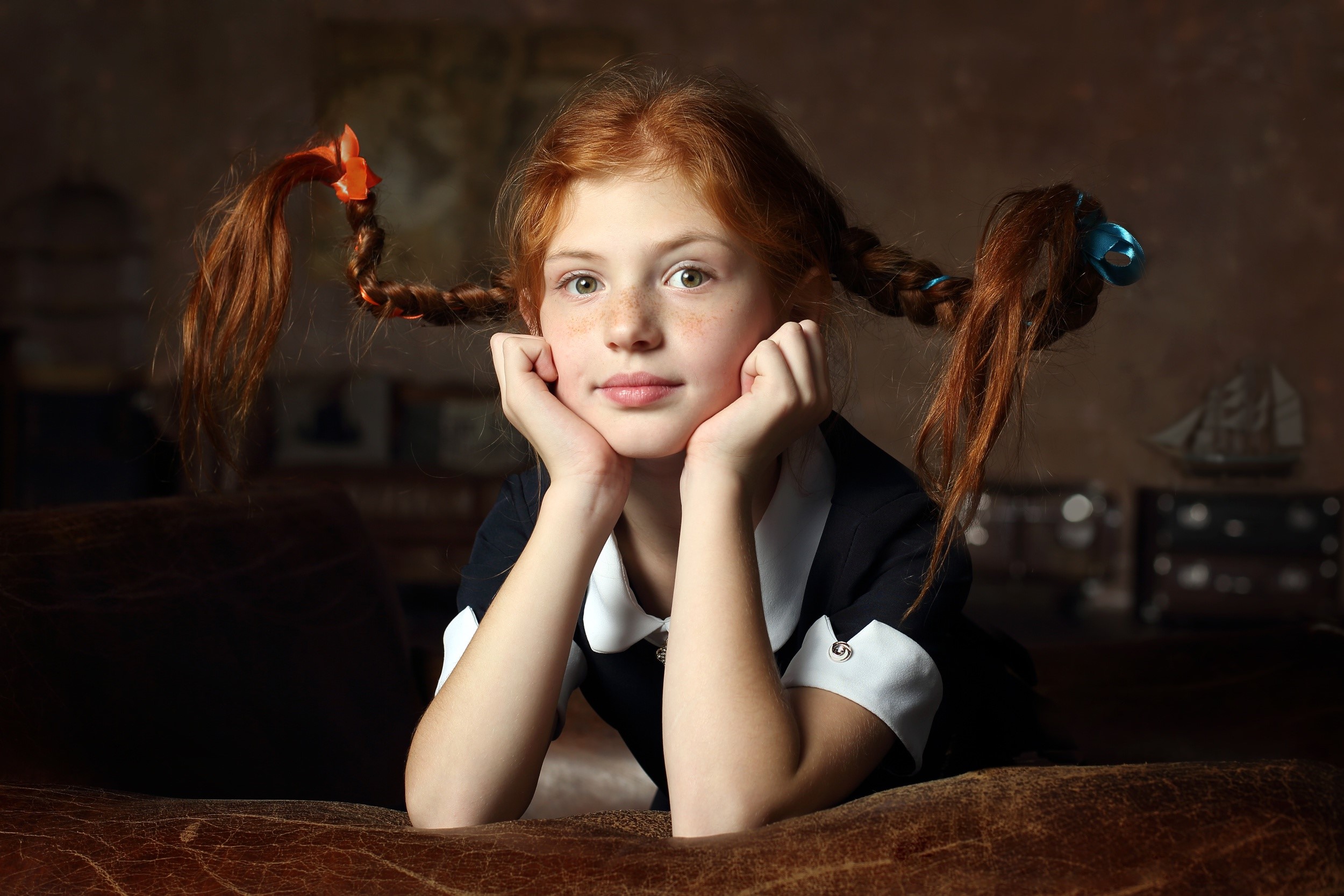 Redhead girl with braided pigtails resting chin on hands HD Wallpaper