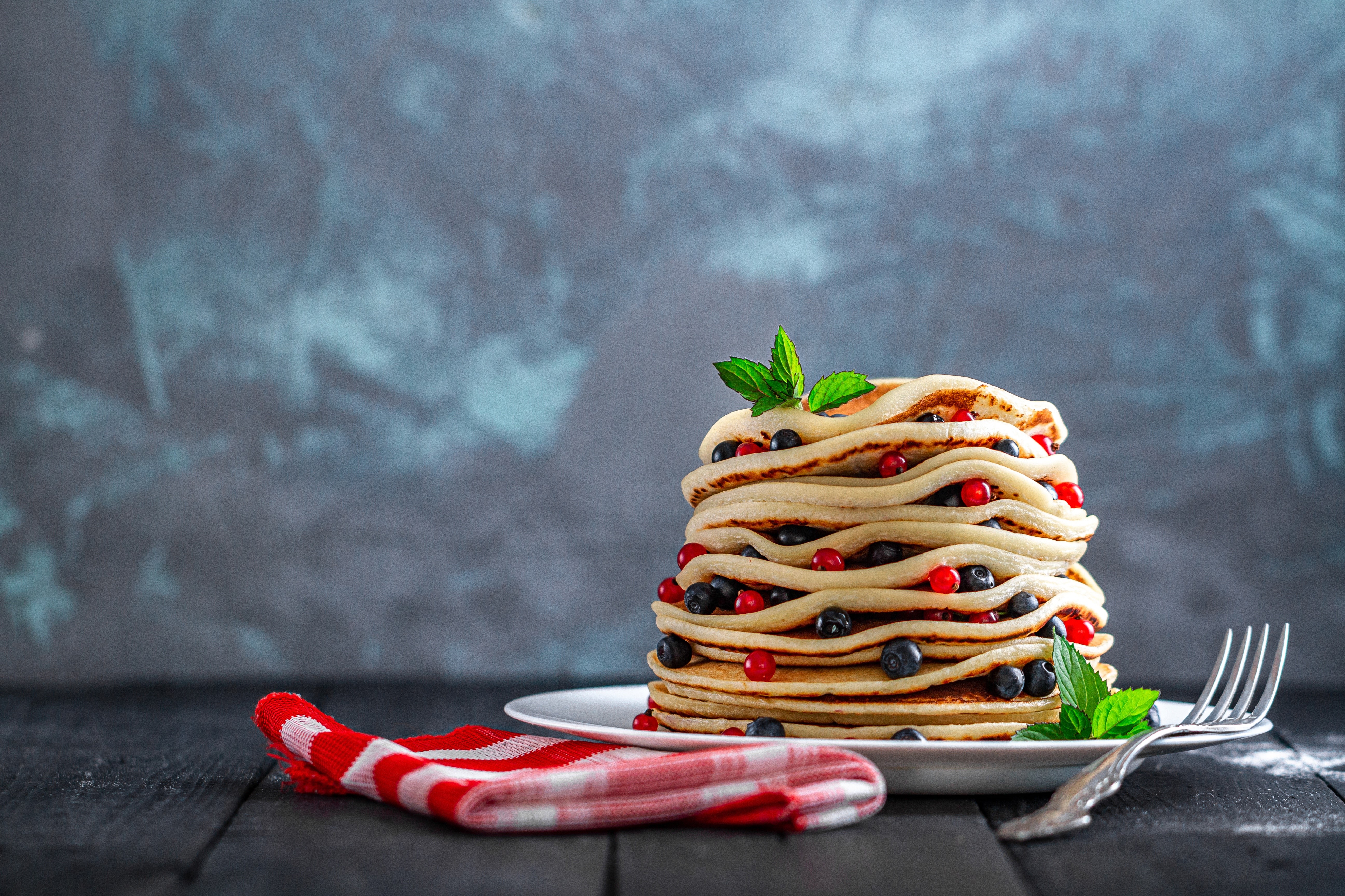 Pancakes with berries and mint on a plate with a fork HD Wallpaper
