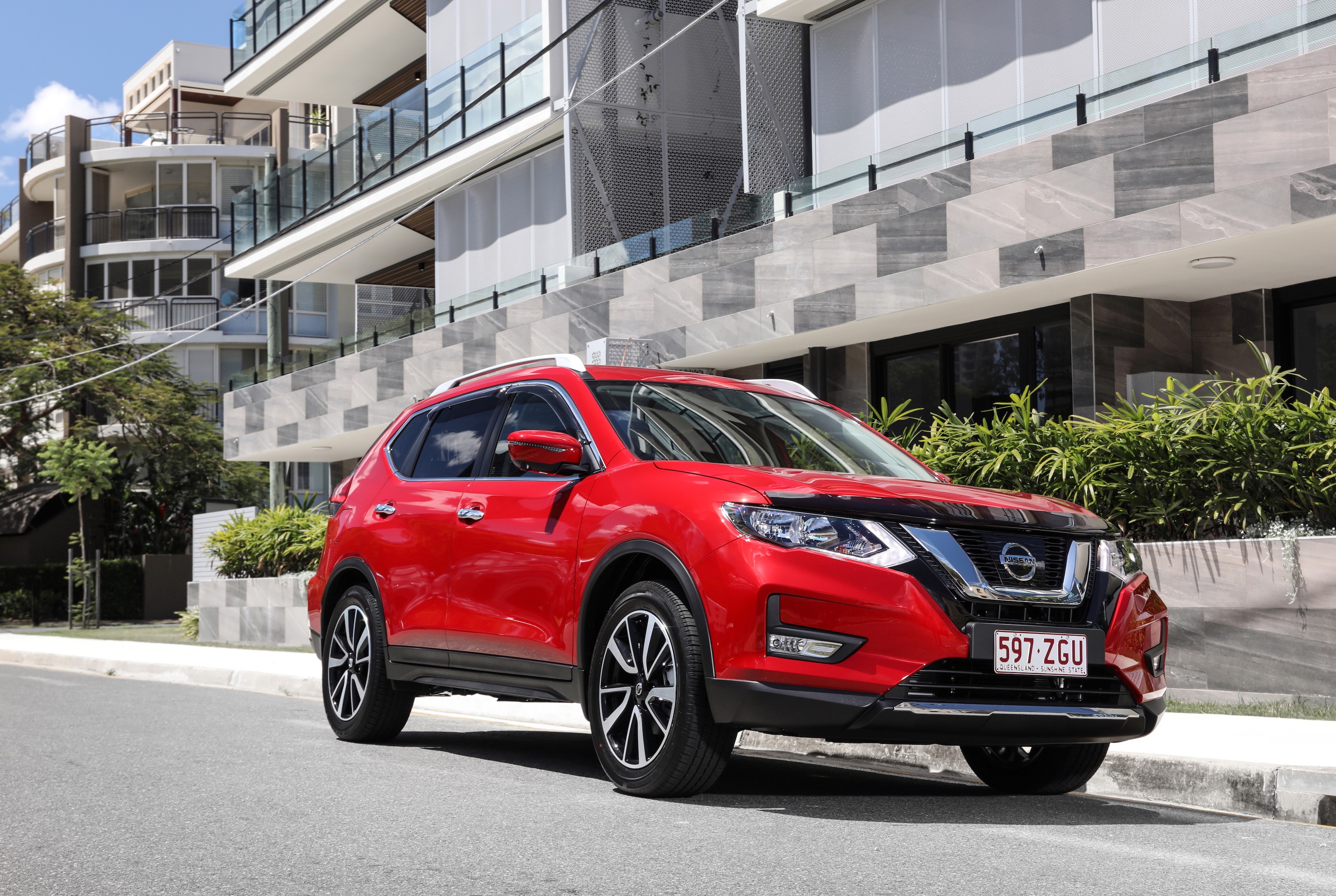 Red Nissan X-Trail N-Trek parked on street HD Wallpaper