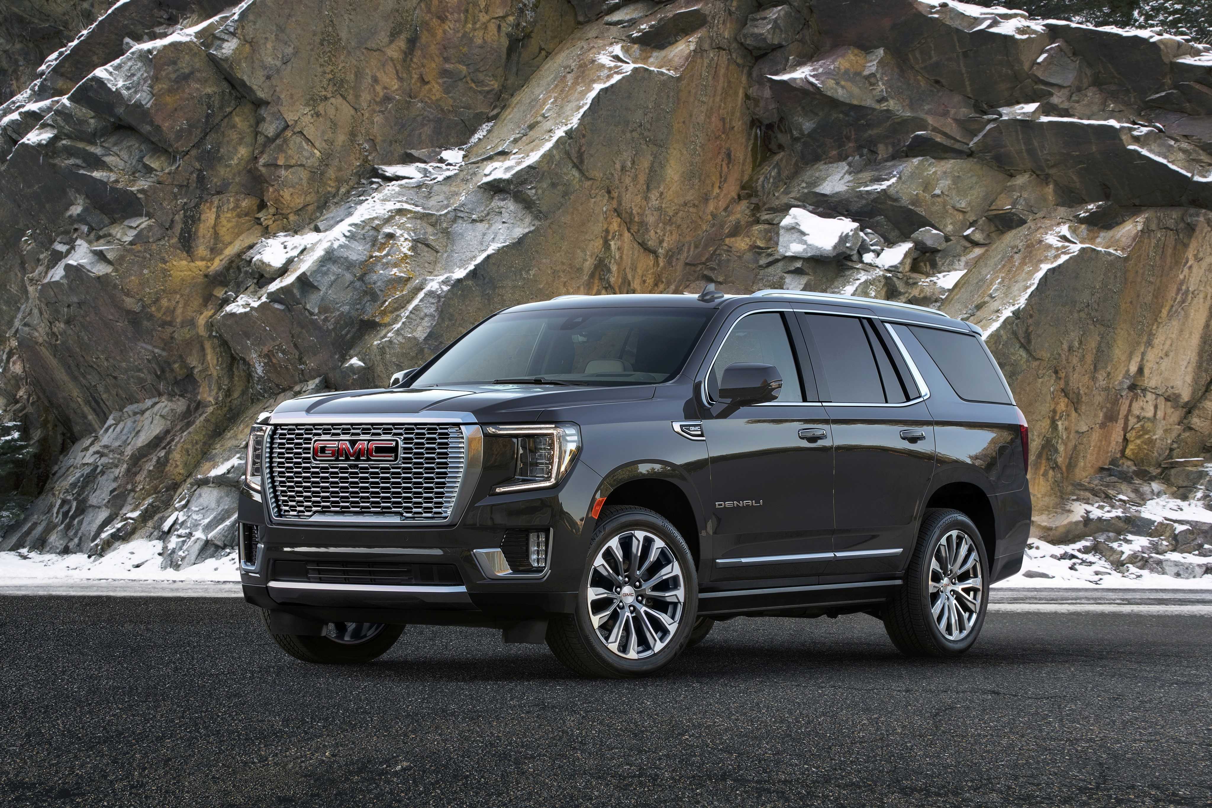 GMC Yukon Denali SUV on a rocky road HD Wallpaper