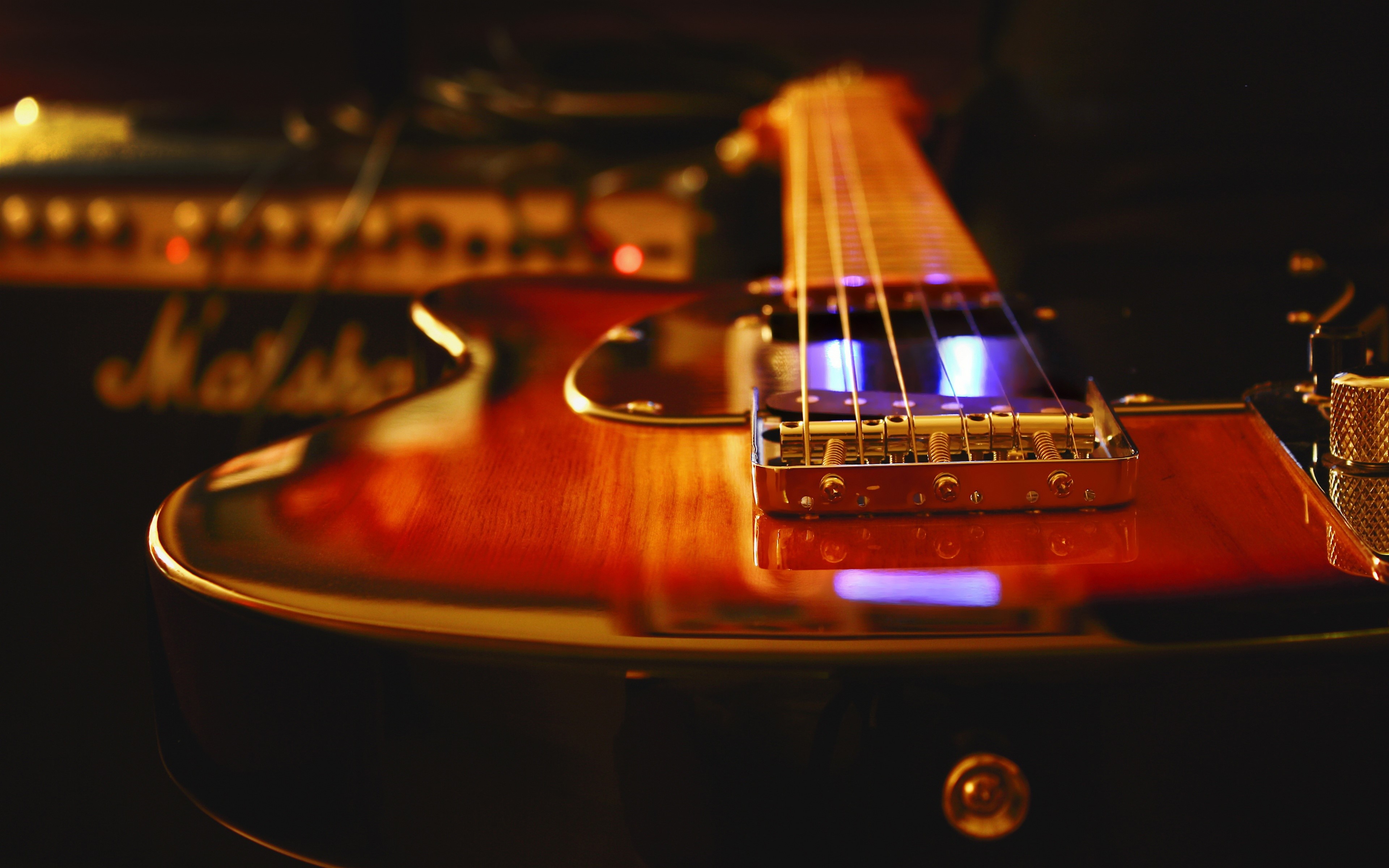 Closeup of a sunburst electric guitar and Marshall amplifier HD Wallpaper