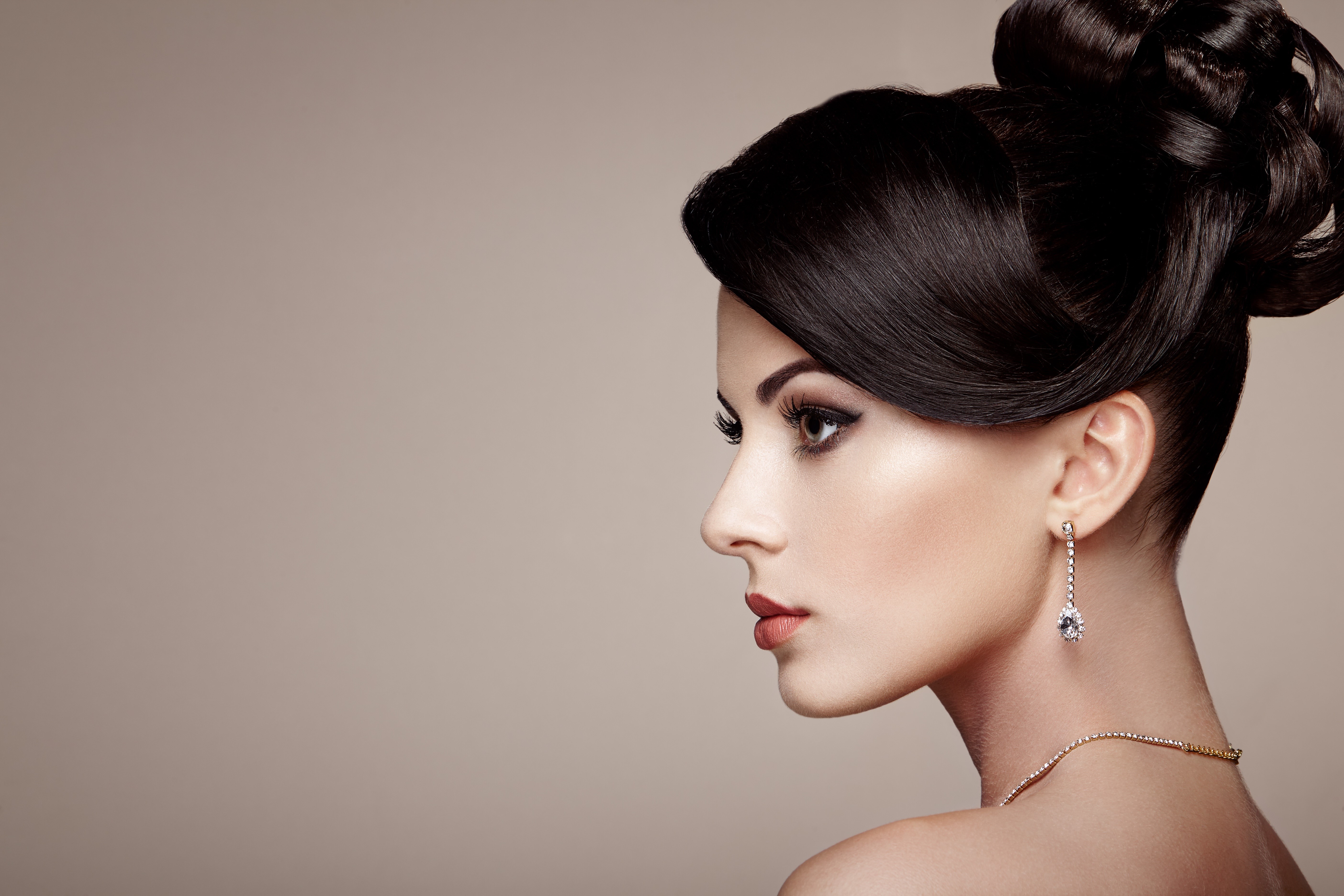 Woman with elegant updo and diamond earrings HD Wallpaper