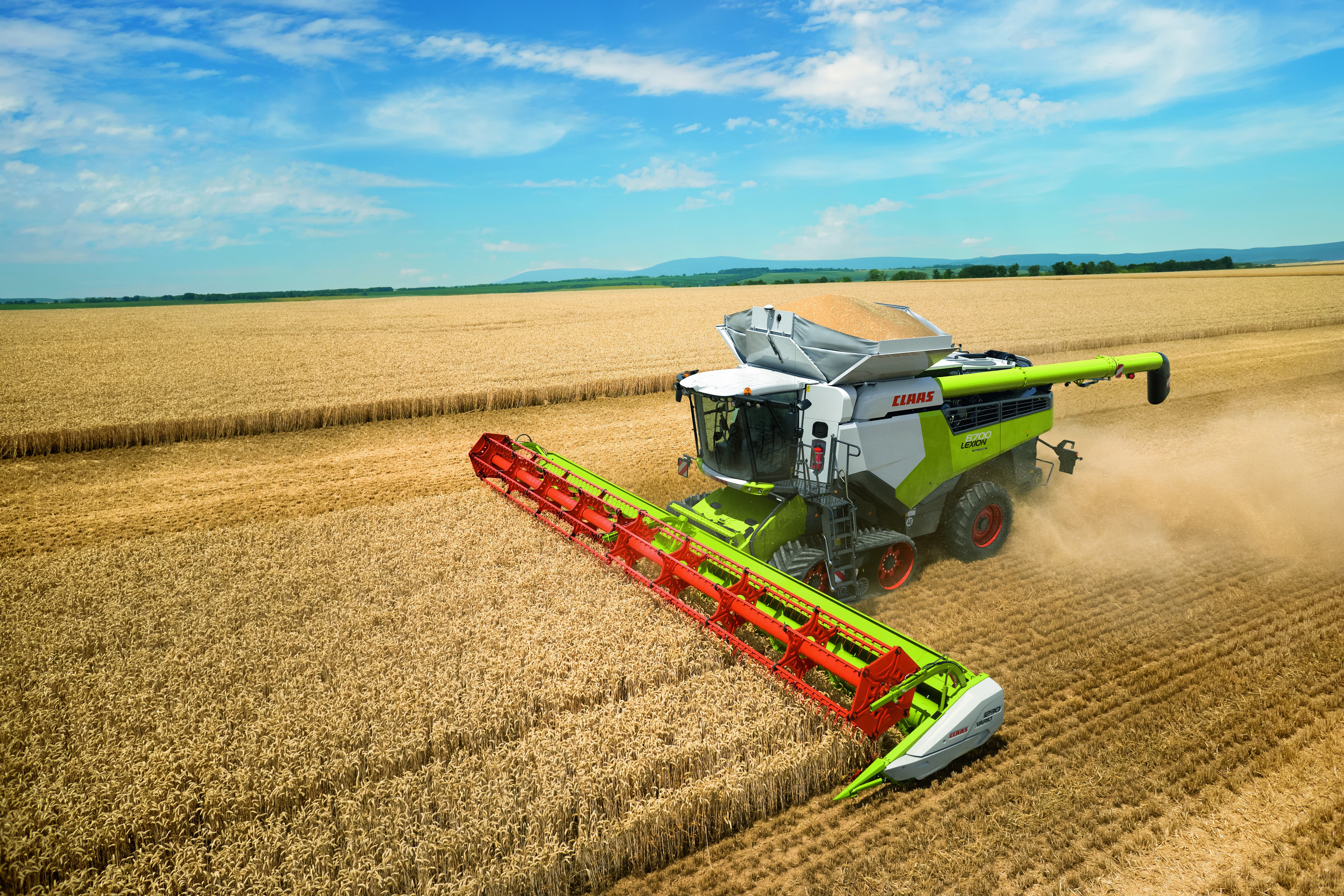 Claas Lexion 8700 combine harvester in wheat field HD Wallpaper