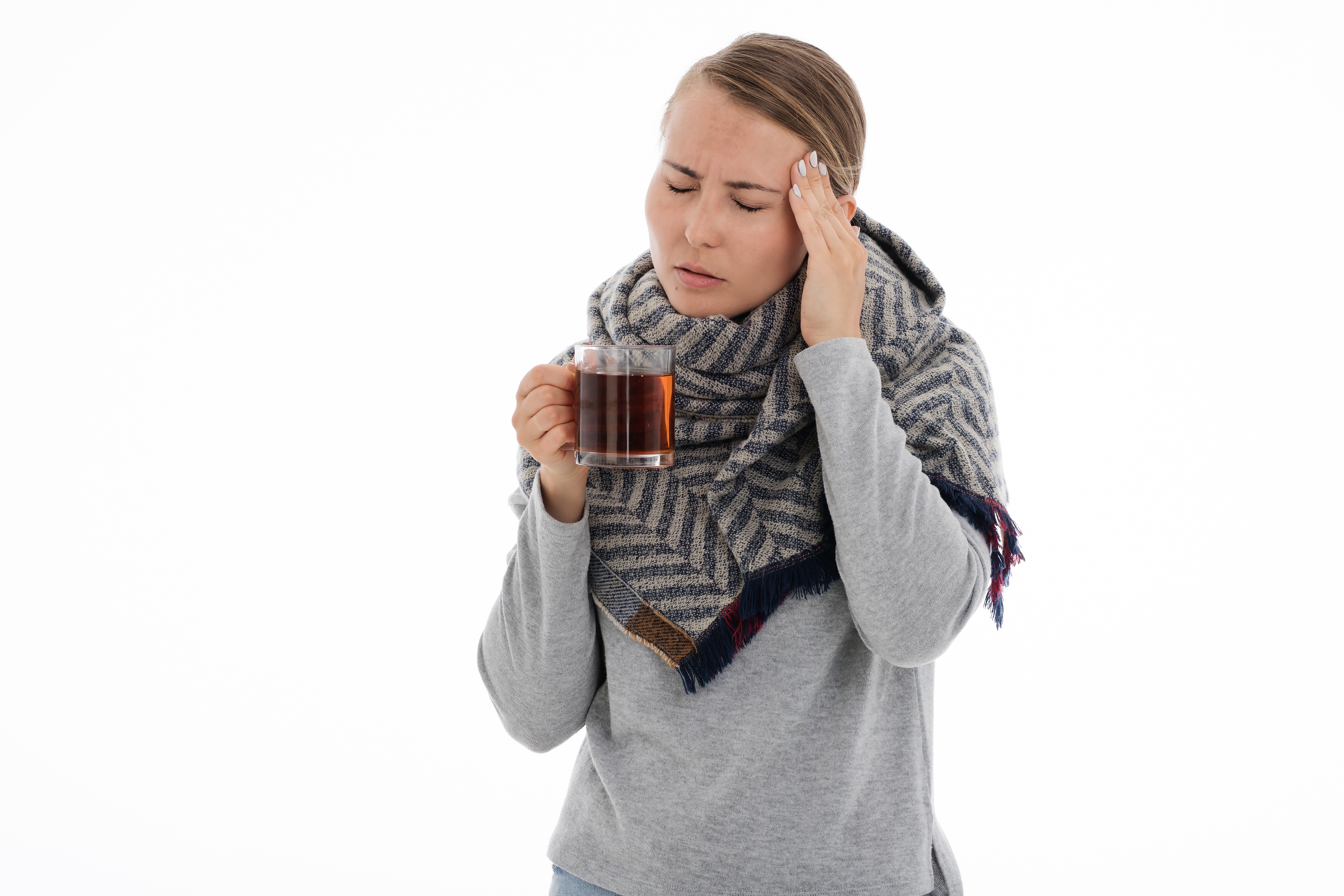 Woman with headache holding tea mug HD Wallpaper