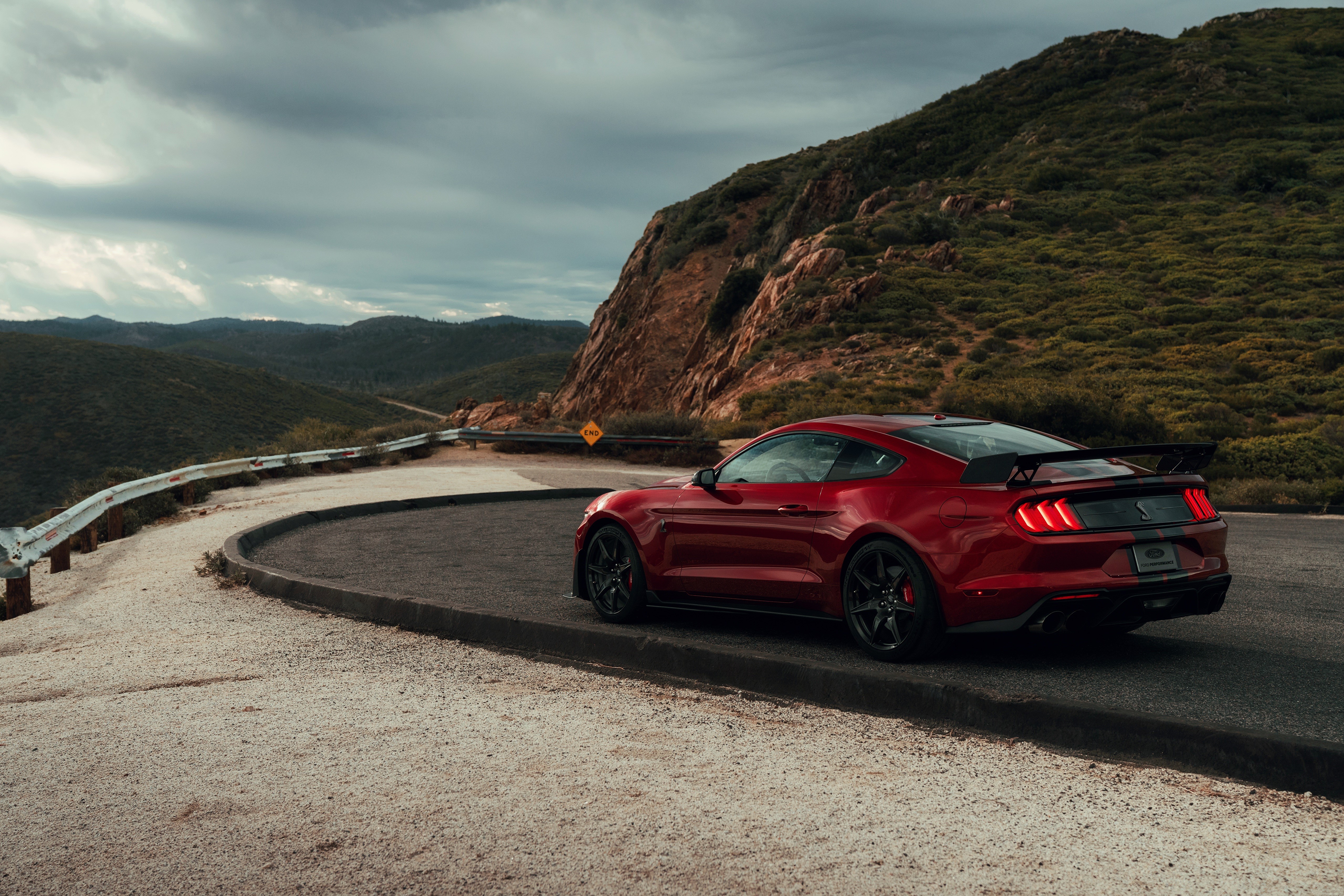 Red Ford Mustang Shelby GT500 on mountain road HD Wallpaper