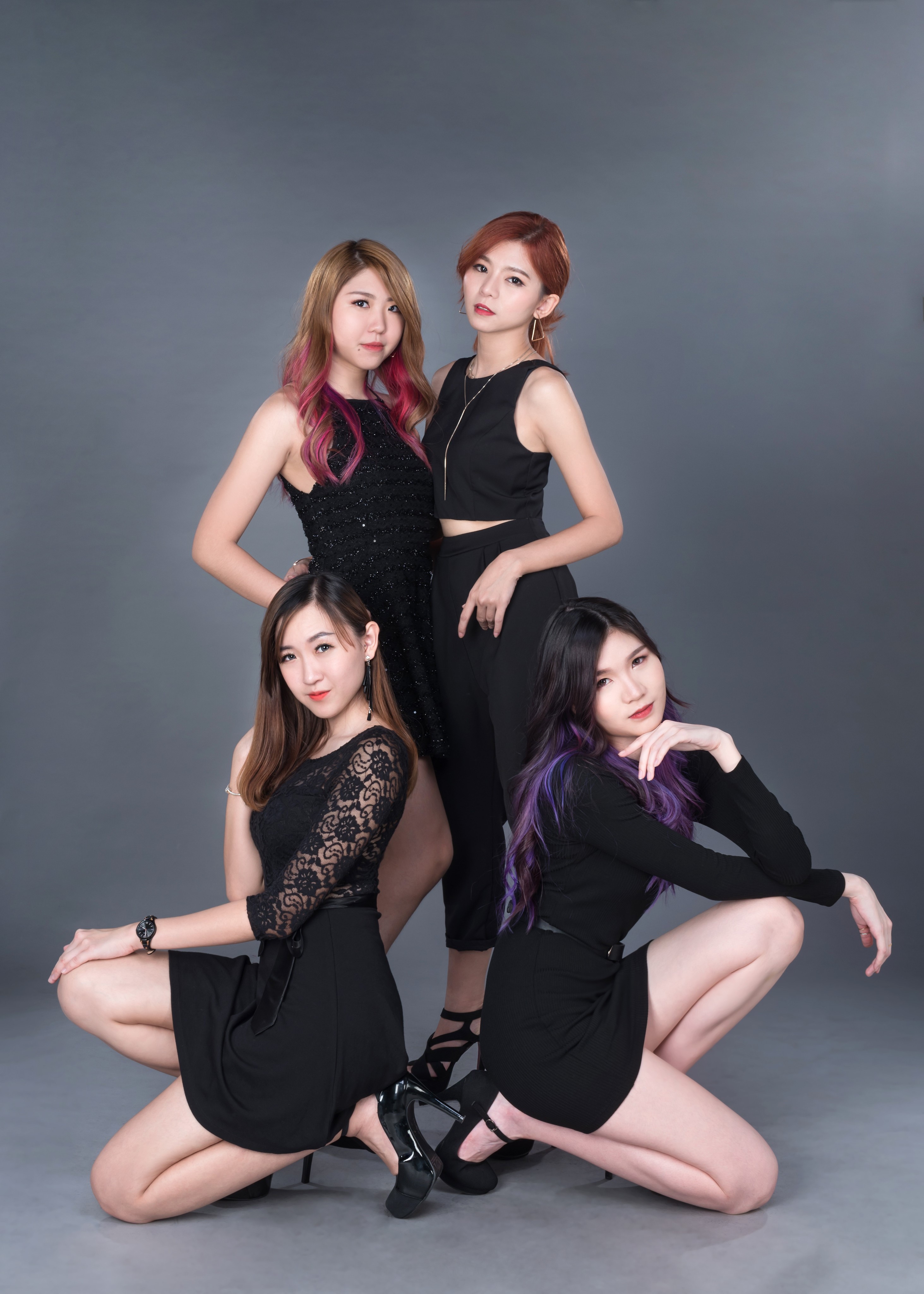 Four Asian women posing in black outfits HD Phone Wallpaper