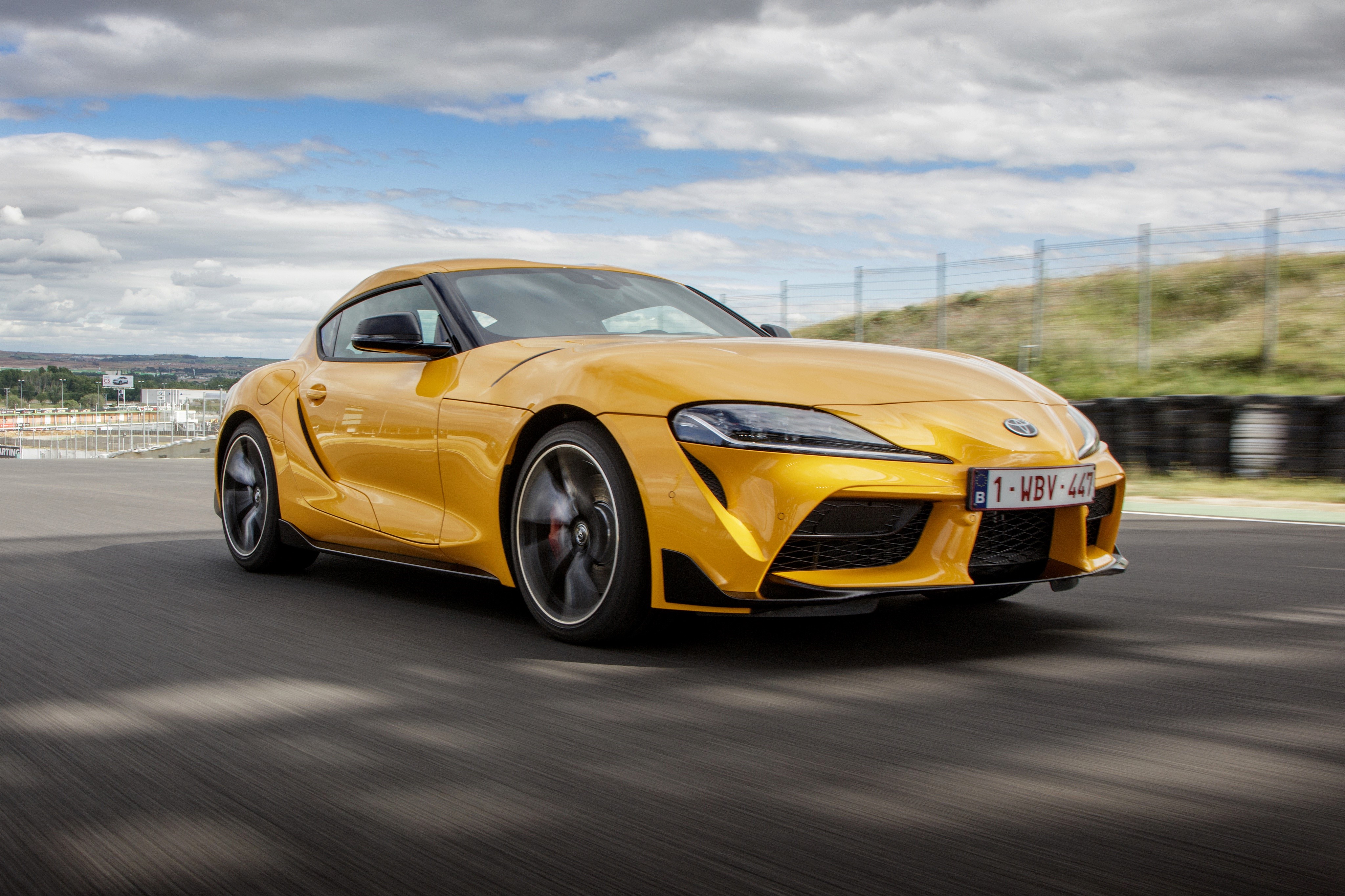 Yellow 2019 Toyota GR Supra A90 Coupe on Track HD Wallpaper
