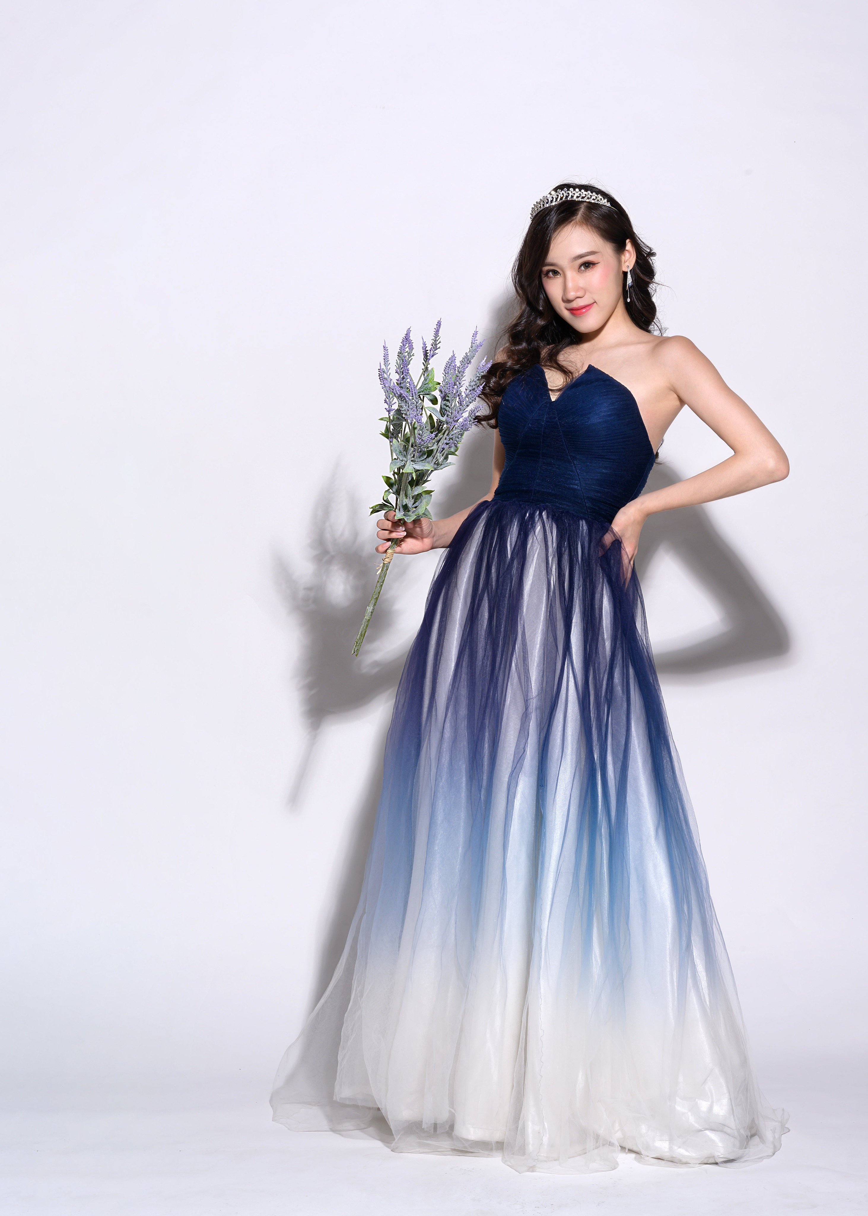 Asian woman in a blue ombre gown holding lavender HD Phone Wallpaper