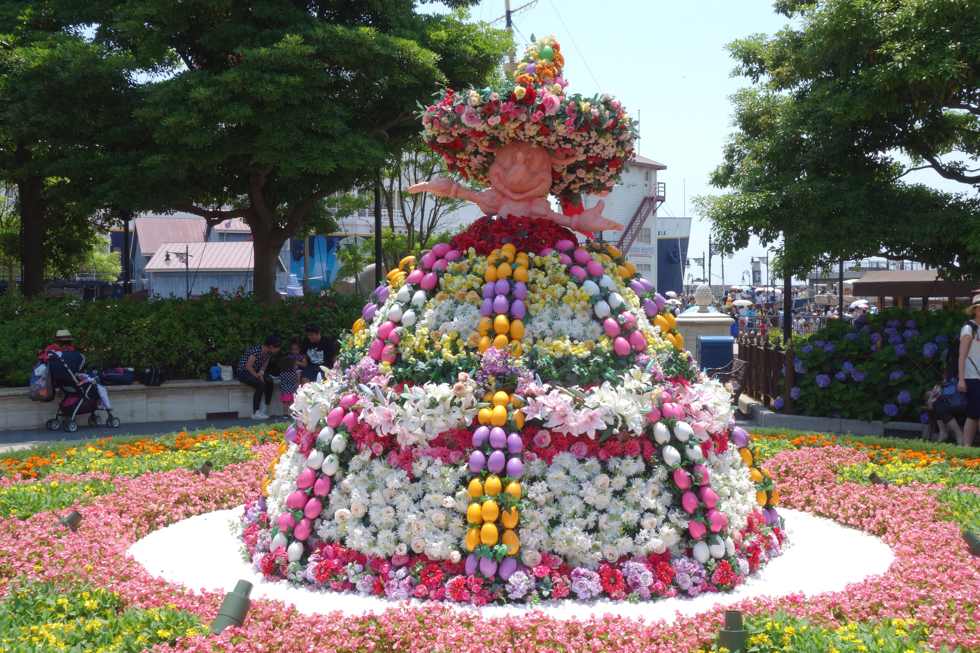Flower Display of a Character in a Hat HD Wallpaper