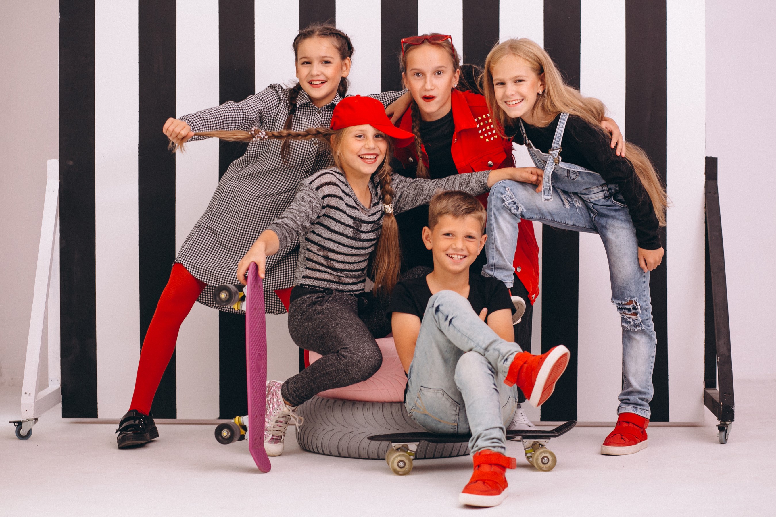 Group of children posing with skateboards HD Wallpaper