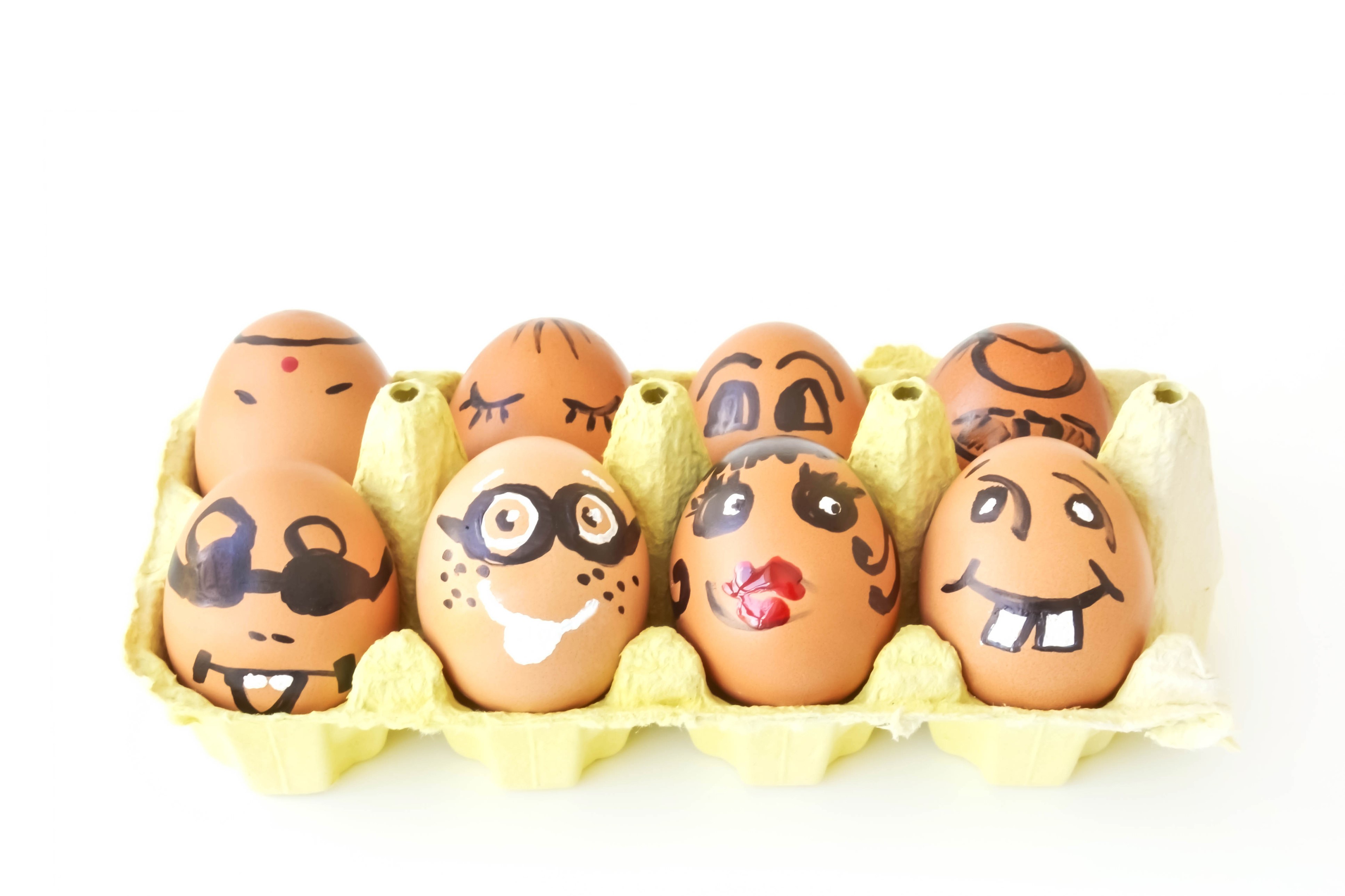 Easter eggs with faces in a carton HD Wallpaper