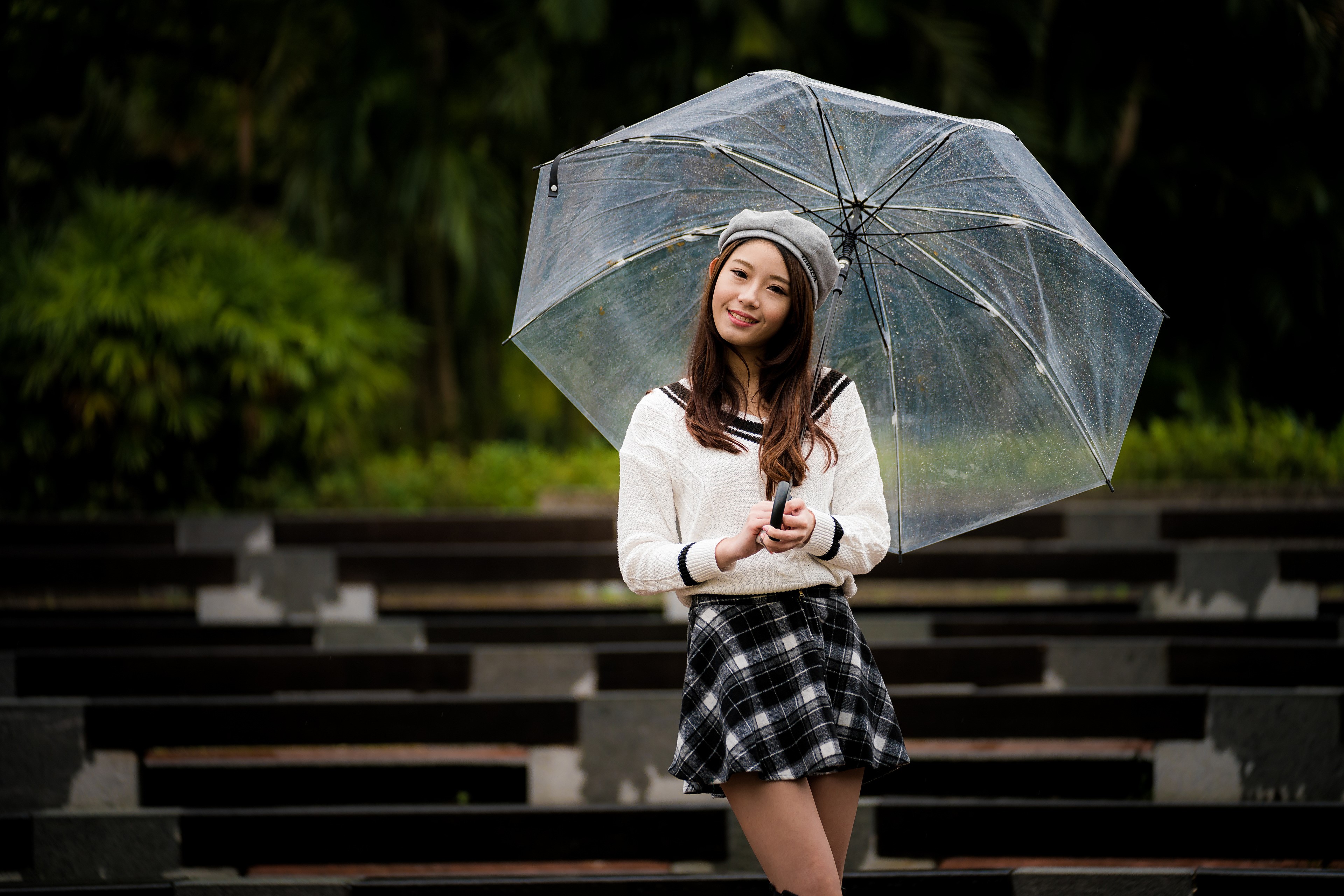 Asian woman with umbrella wearing skirt and sweater HD Wallpaper